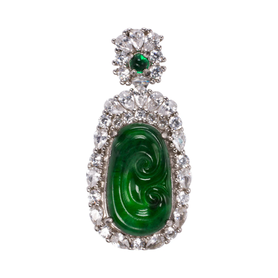 A jade diamond and silver pendant