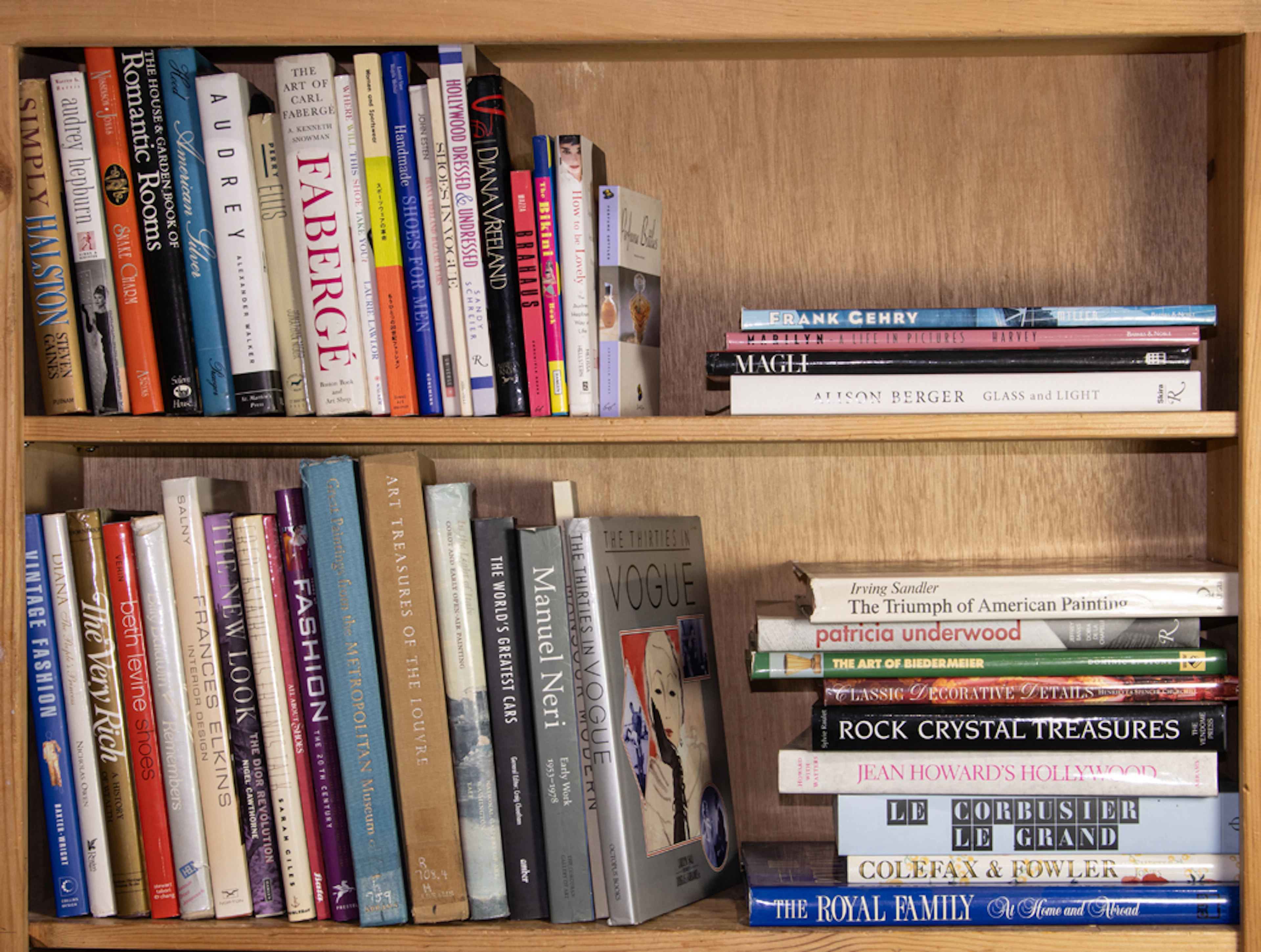 An assembled group of books mainly on the topic of fashion and design