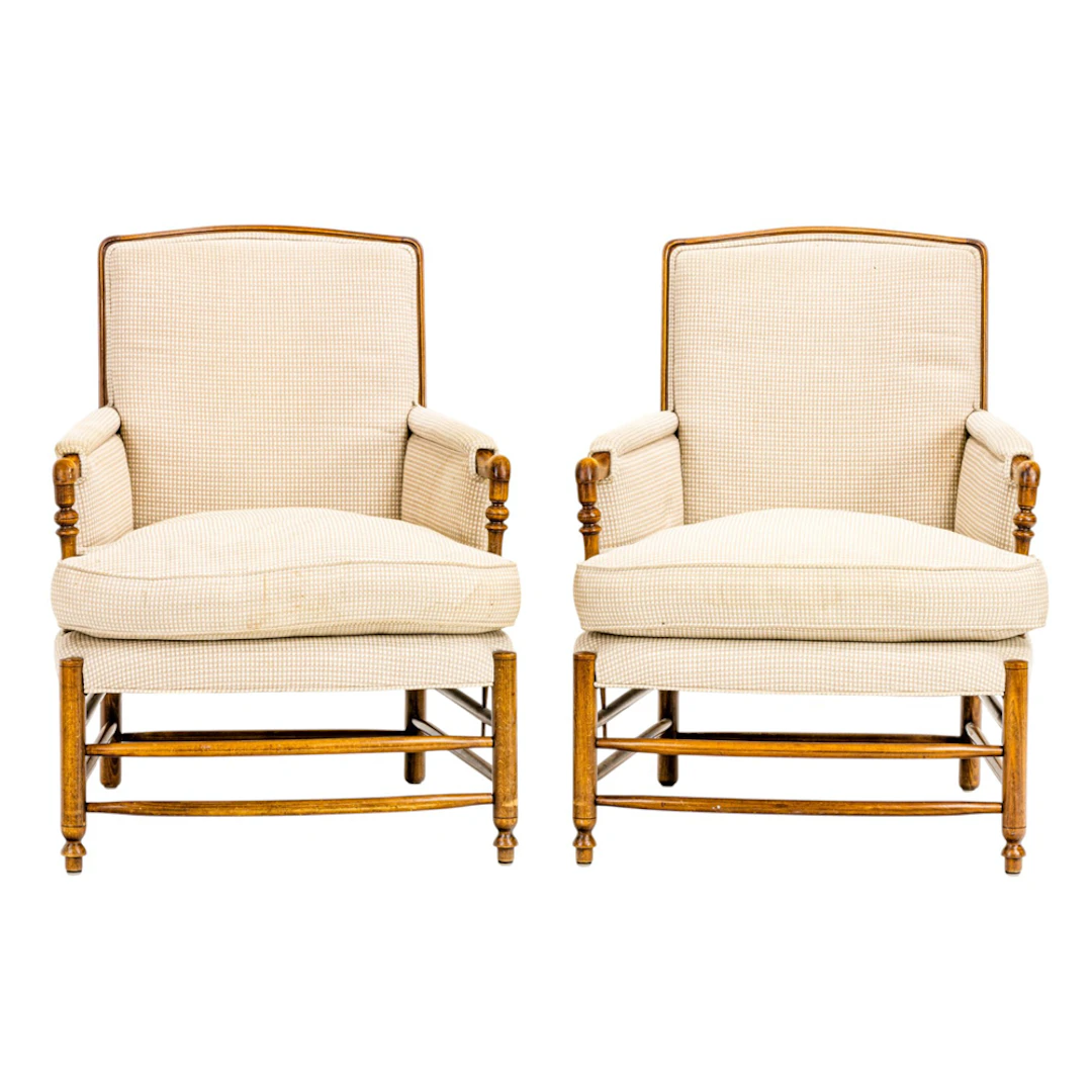 A pair of Provincial style upholstered armchairs