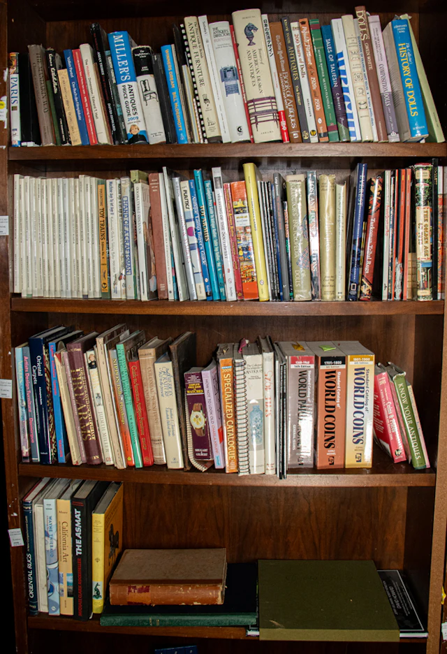 Four shelves of mainly reference books on antique furniture