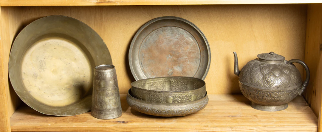 A group of tinned copper and brass