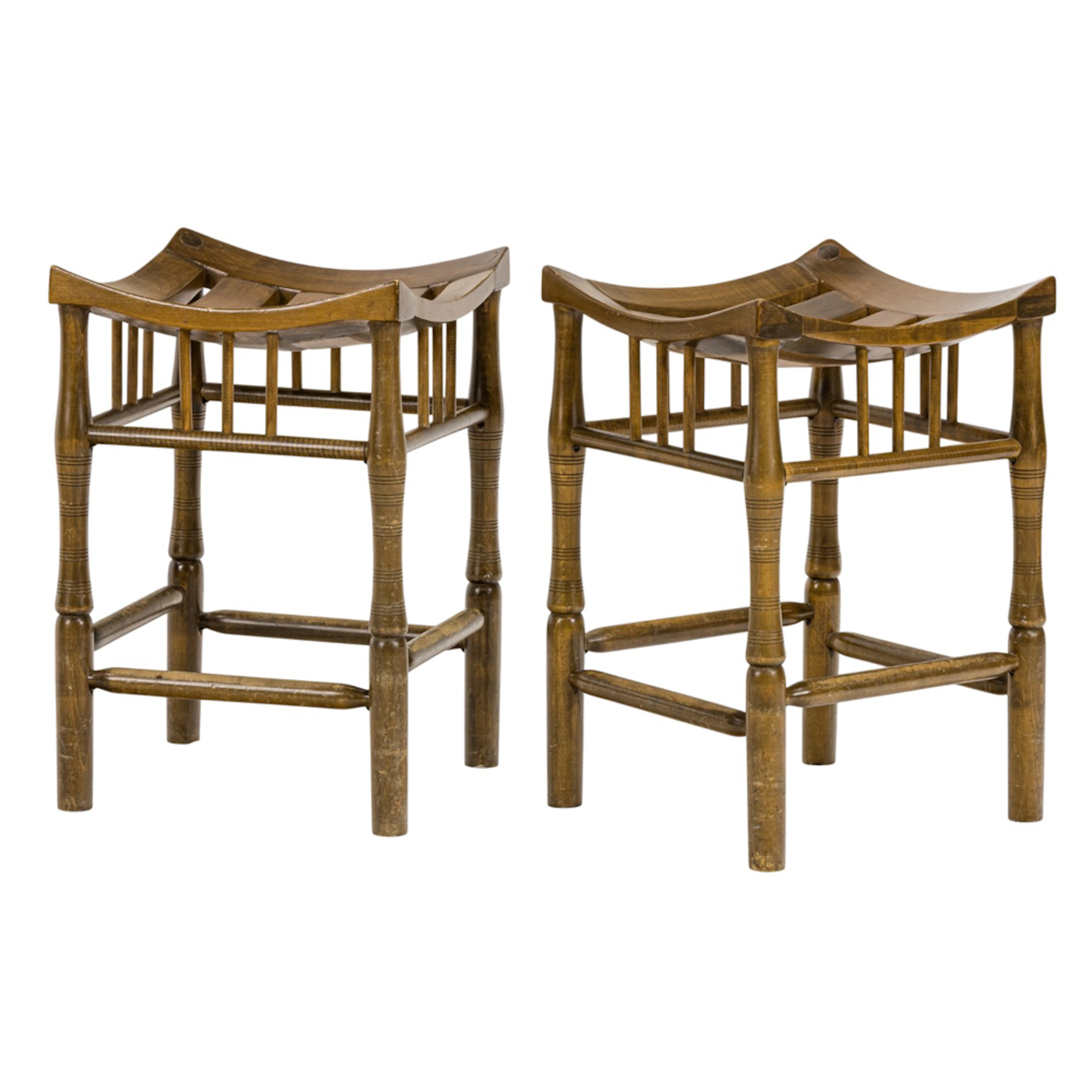 A pair of Thebes style wood stools