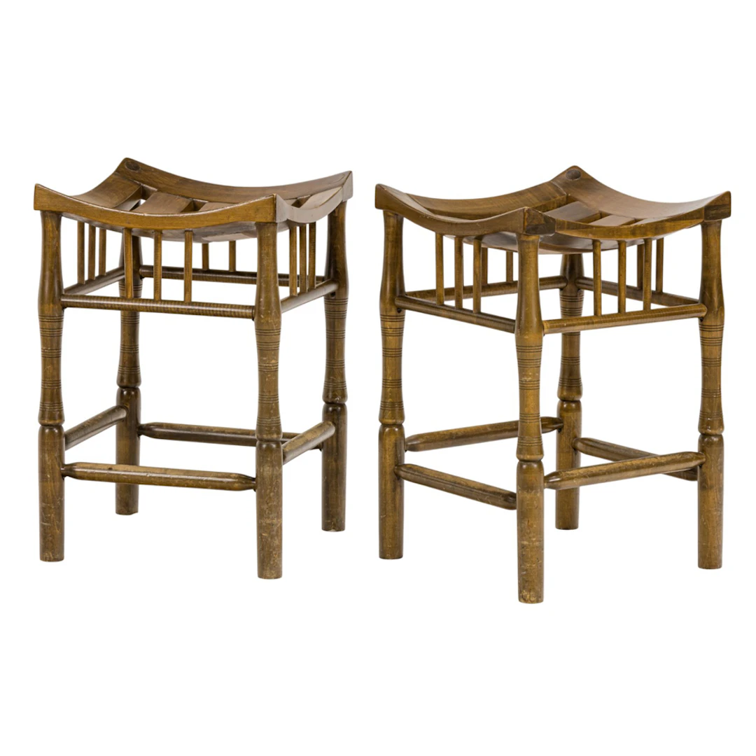 A pair of Thebes style wood stools