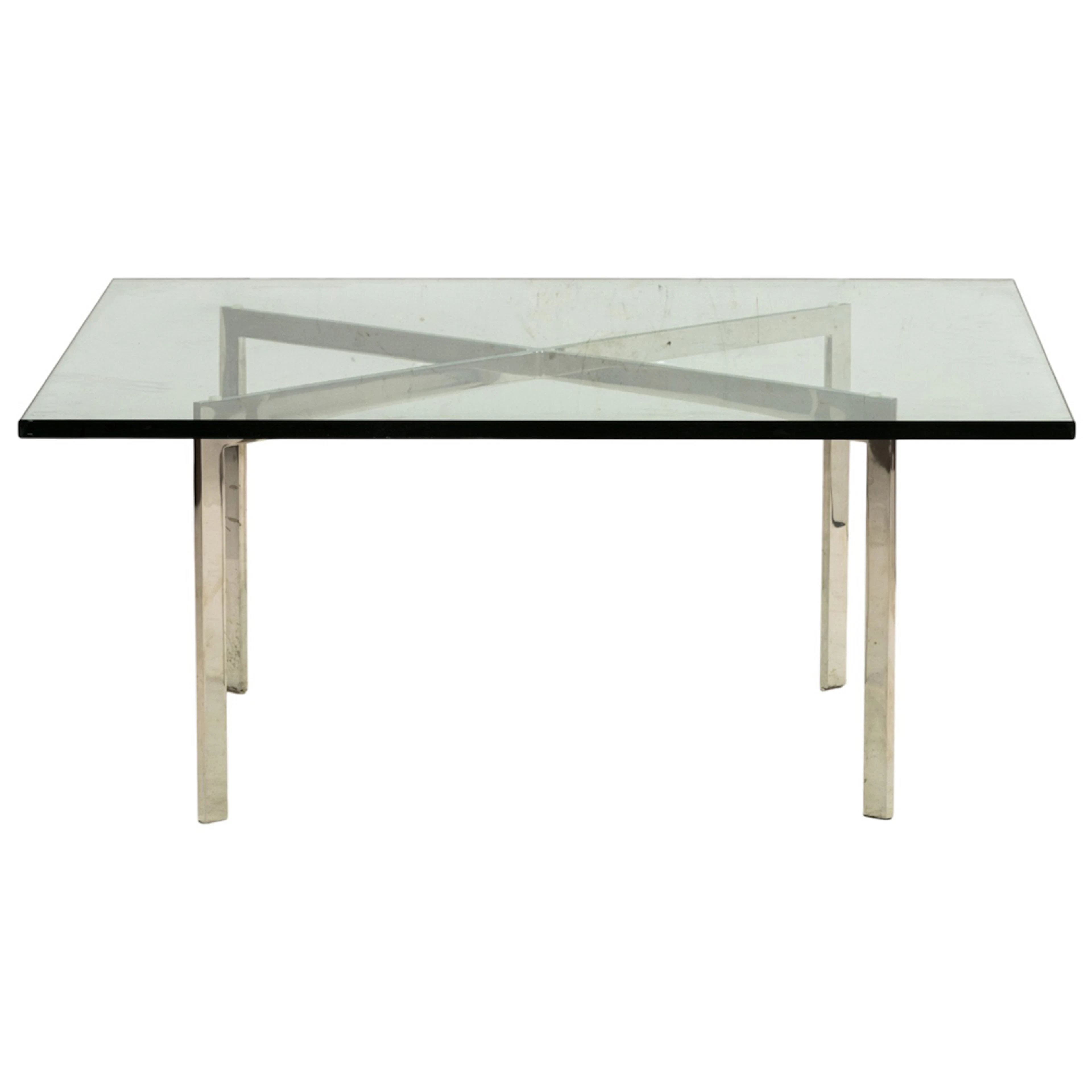 A Ludwig Mies van der Rohe Barcelona table, with a chrome X form base