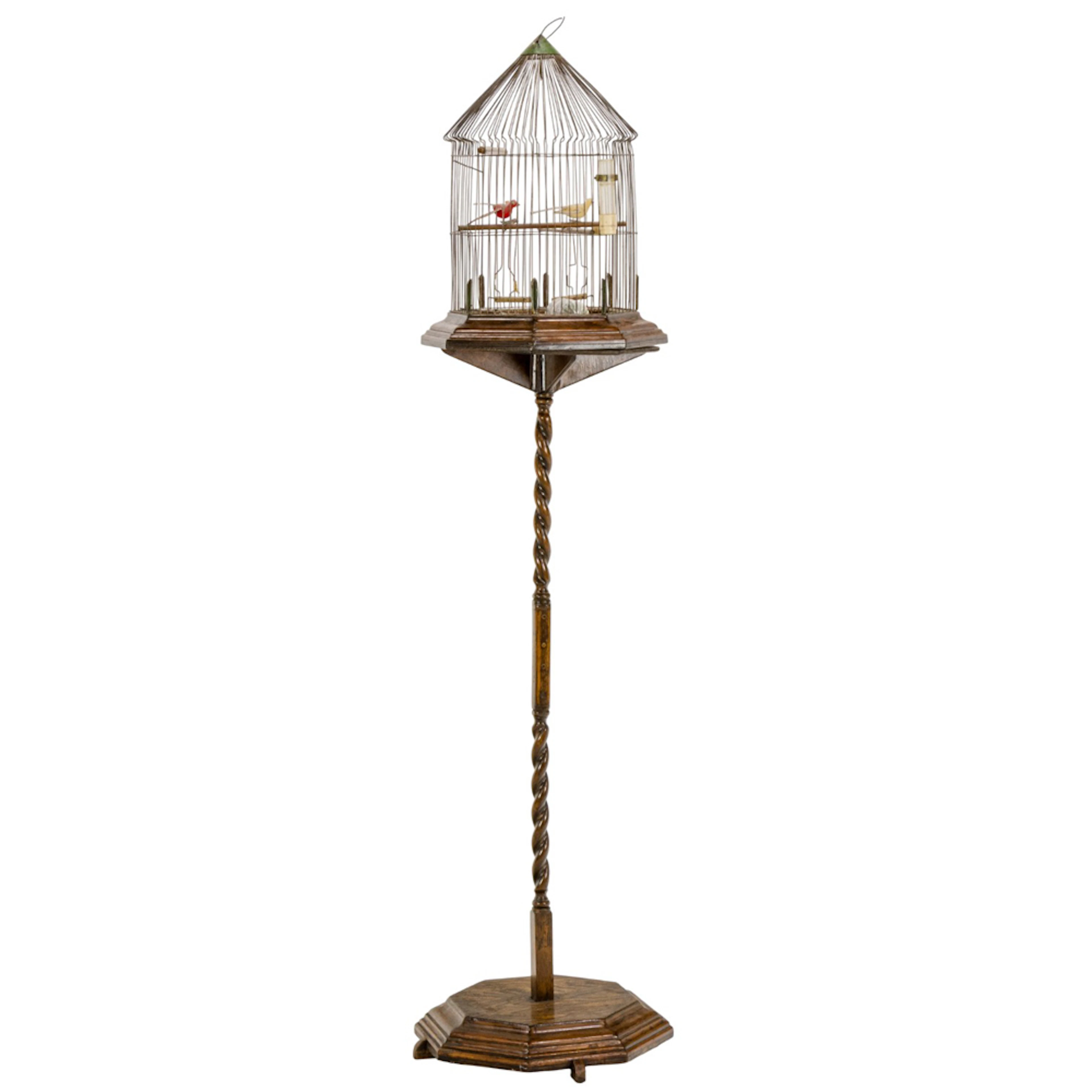 An oak and wire birdcage on stand