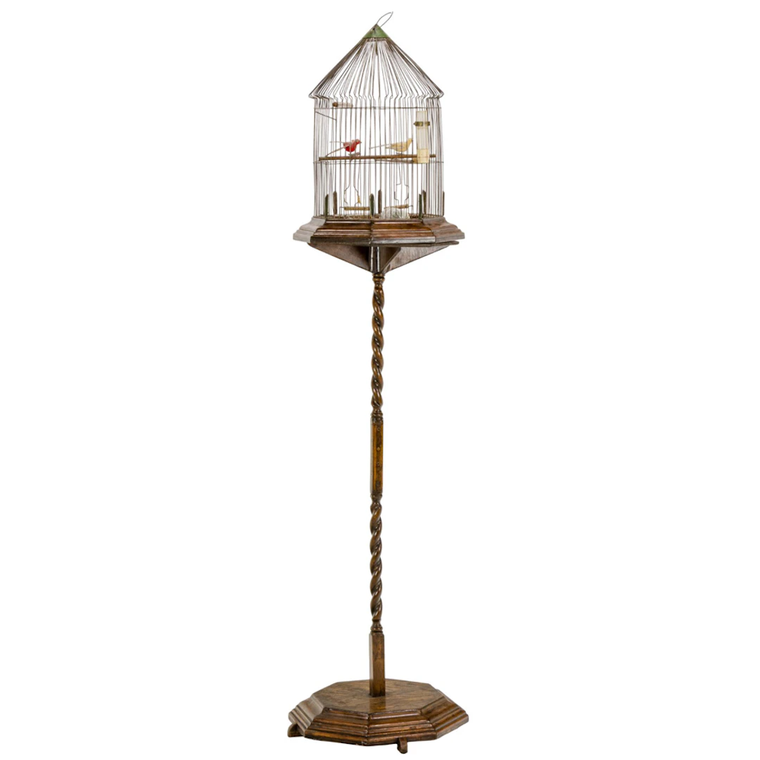 An oak and wire birdcage on stand
