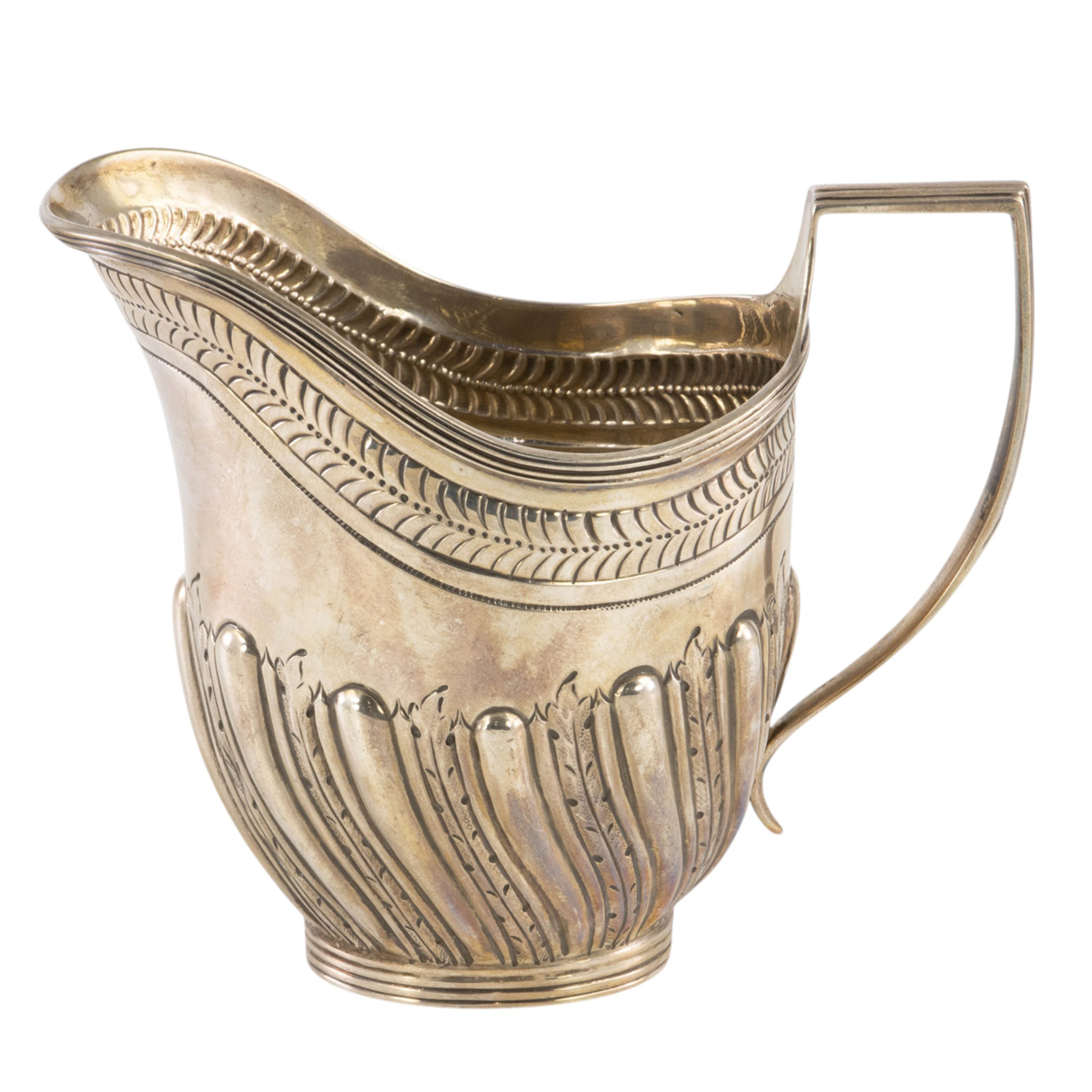 A Victorian hand chased cream pitcher in the George III taste, Charles