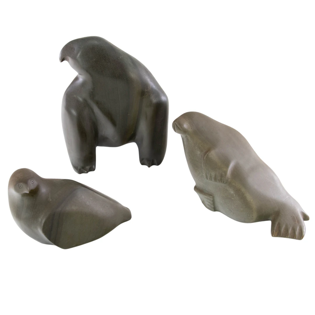 Three Inuit carved stone animals