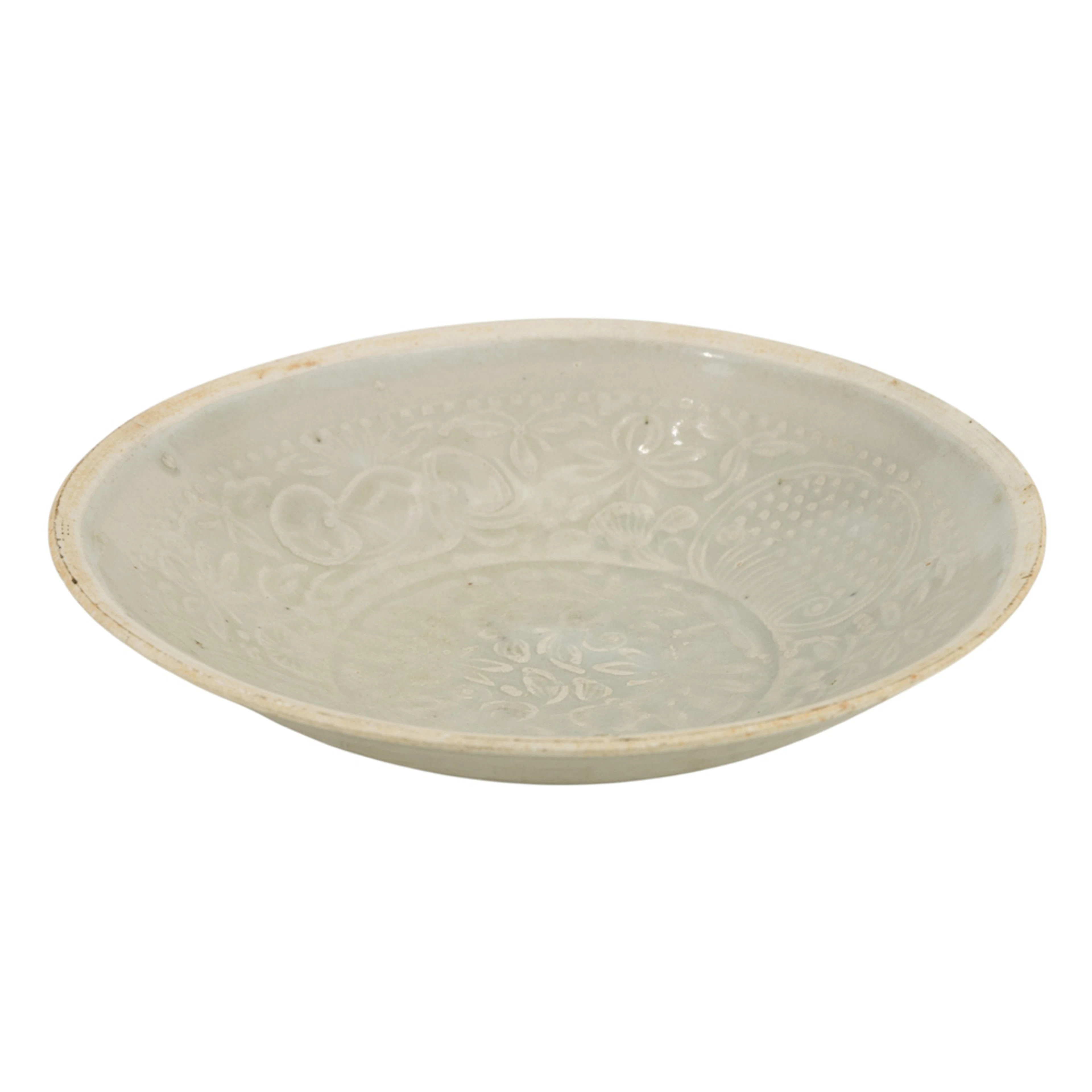 A Chinese Qingbai glazed bowl with molded decoration