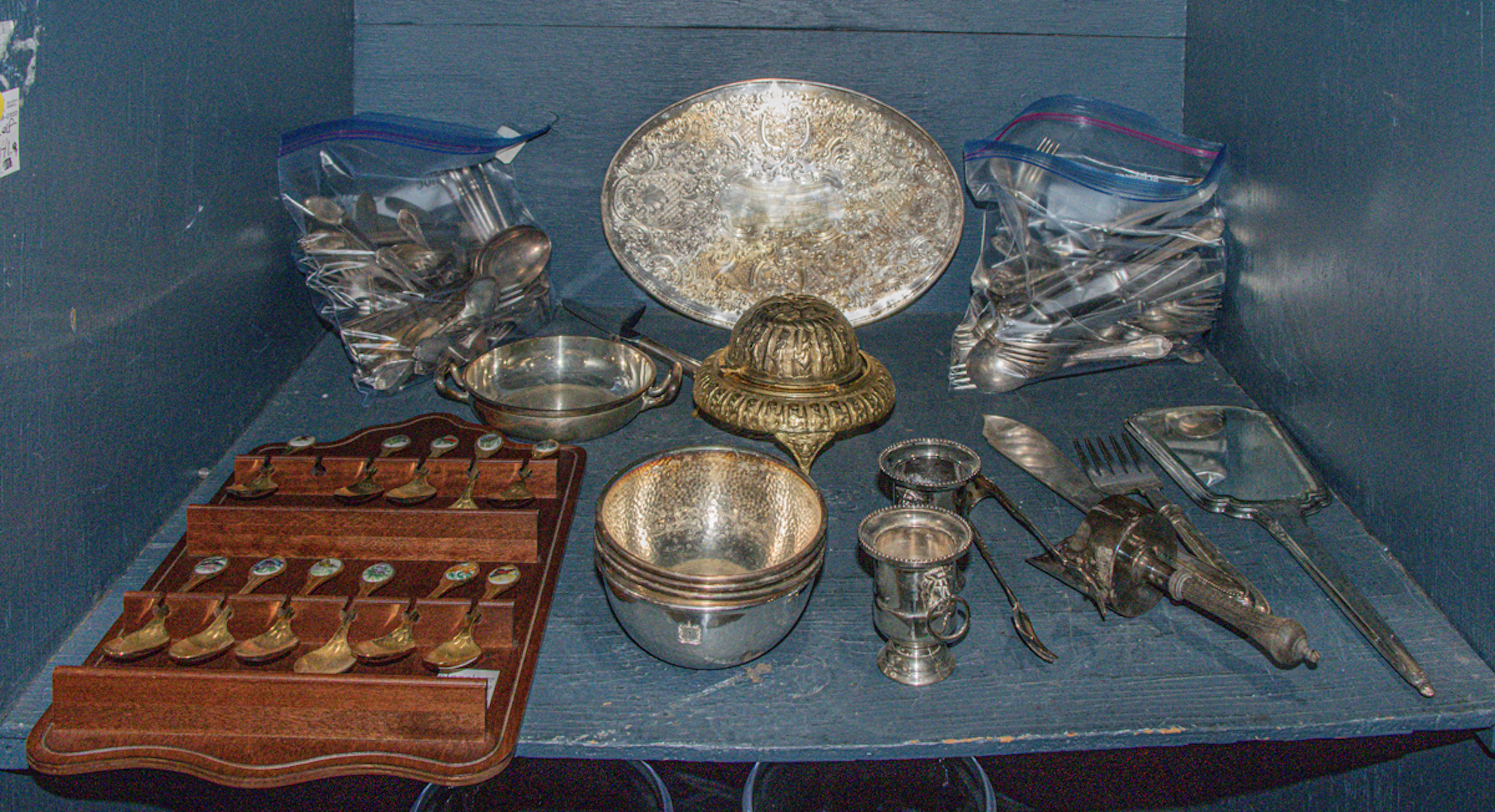 An assembled group of mostly silver plated holloware and flatware
