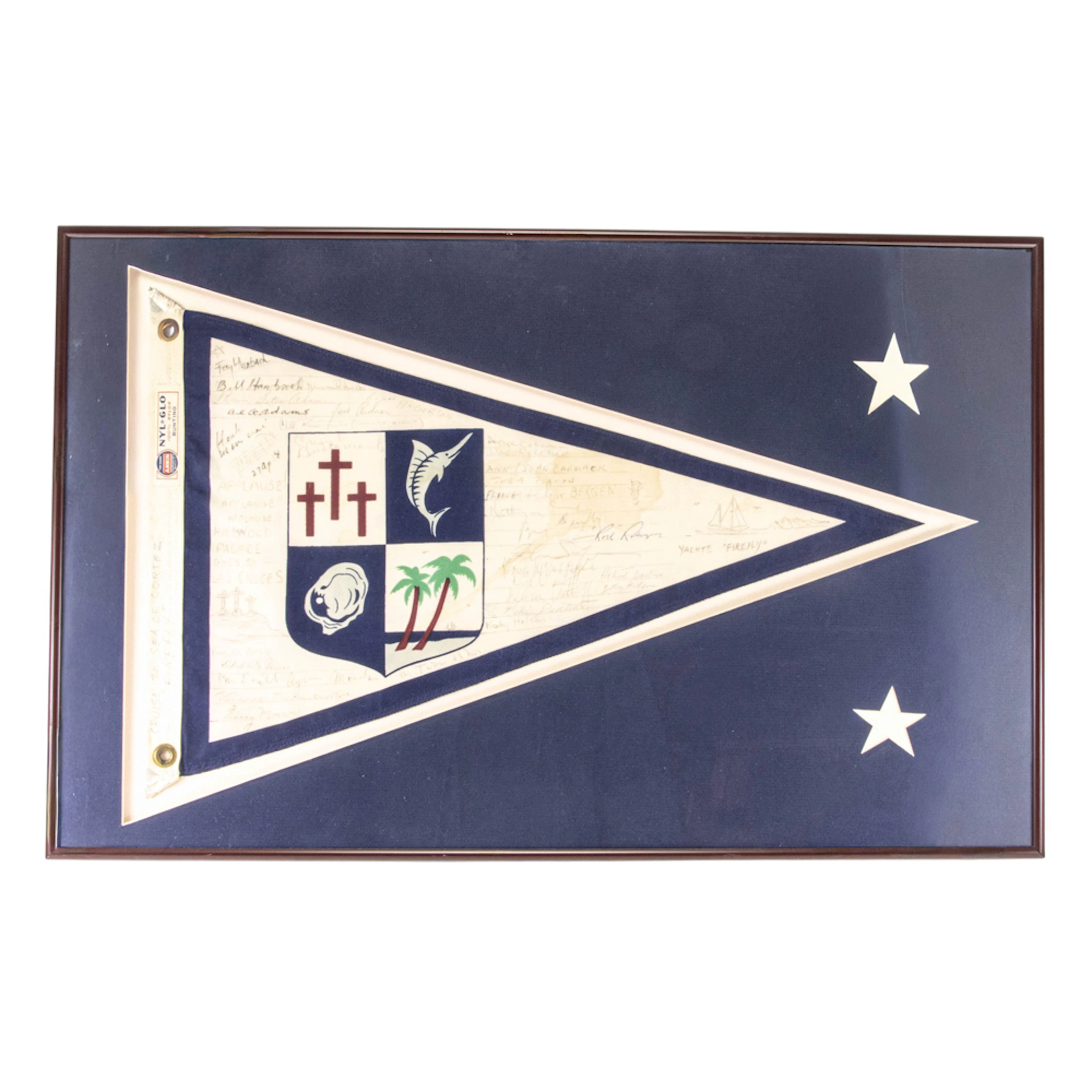 A framed commemorative burgee flag from the sailboat Firefly