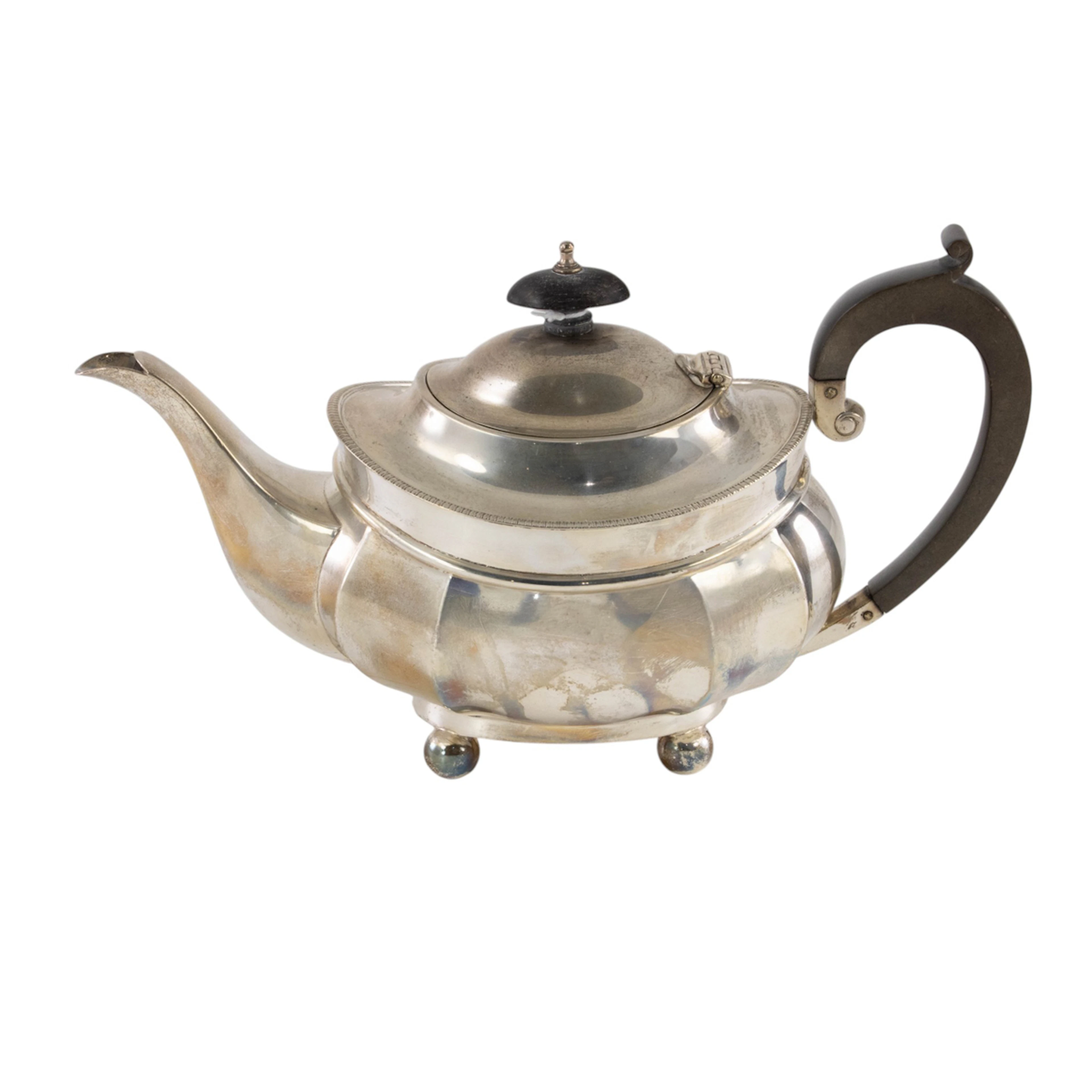 A George V silver bombe and footed teapot
