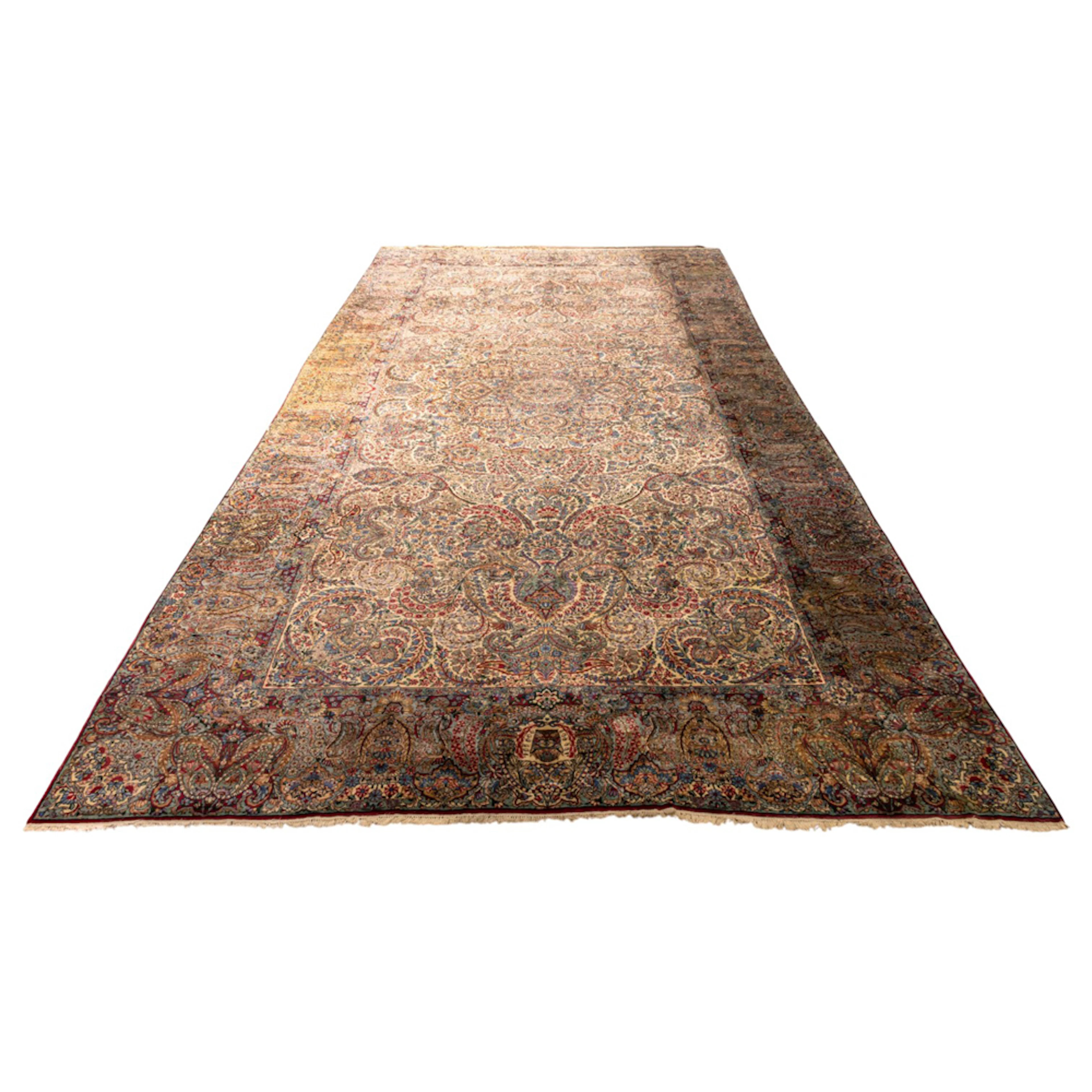 An antique Persian Lavar Kerman carpet