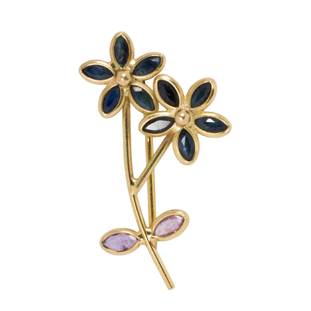 A sapphire and 18k gold brooch