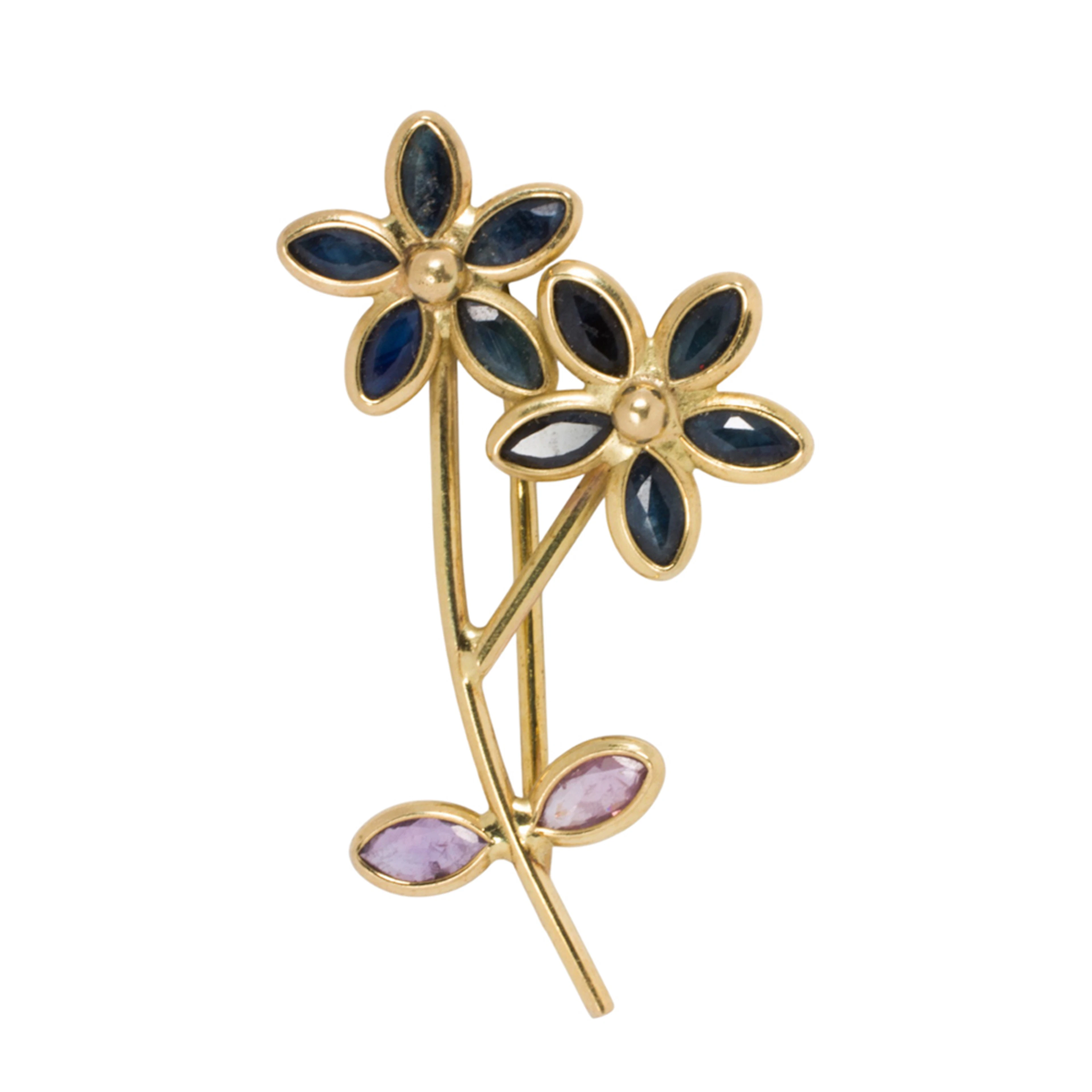 A sapphire and 18k gold brooch