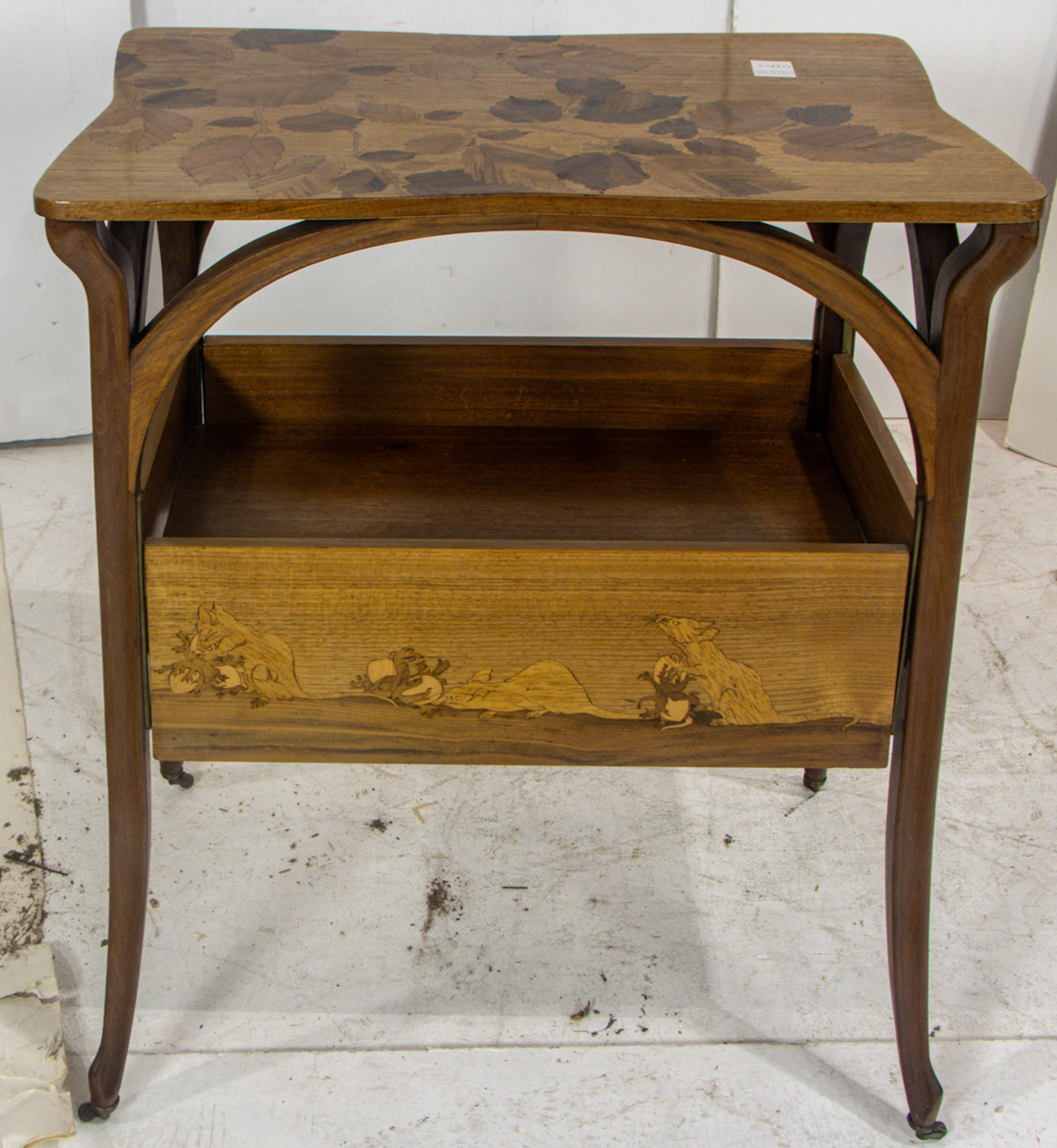 An Art Nouveau Louis Majorelle marquetry decorated salon table