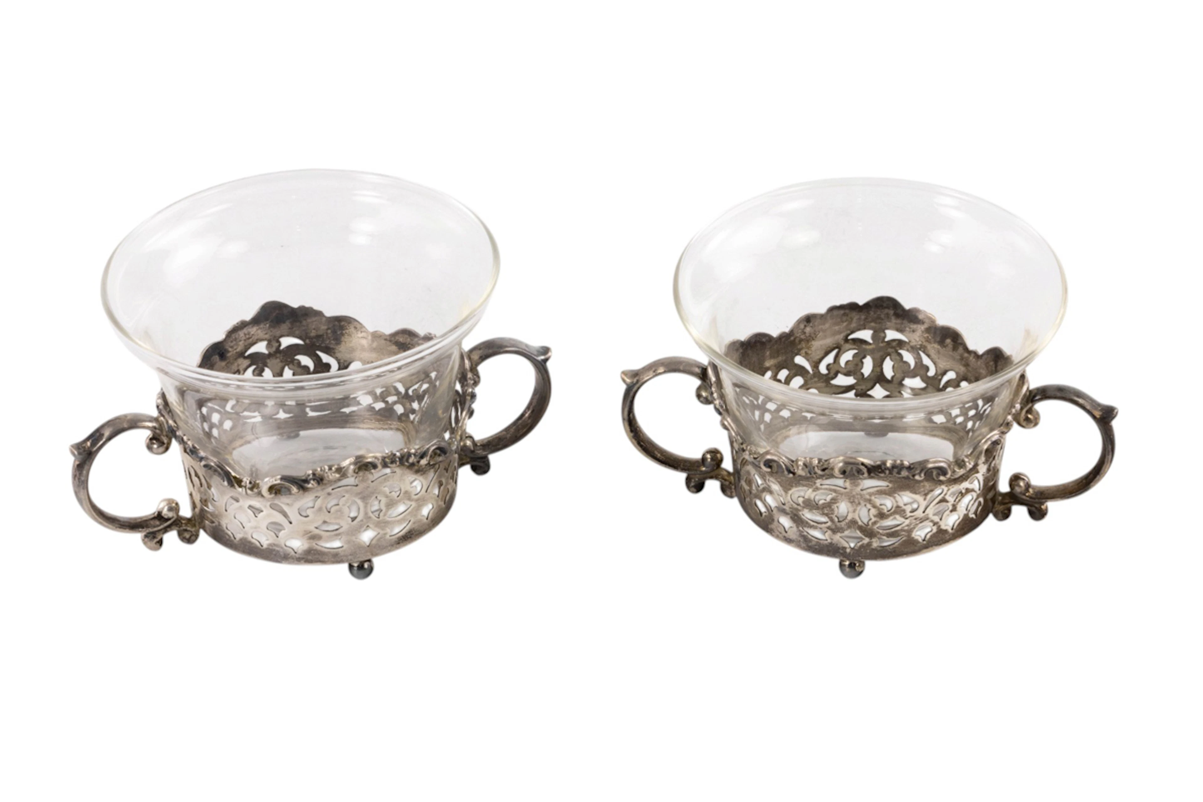 A sterling set of ten footed reticulated baked ramekin frames