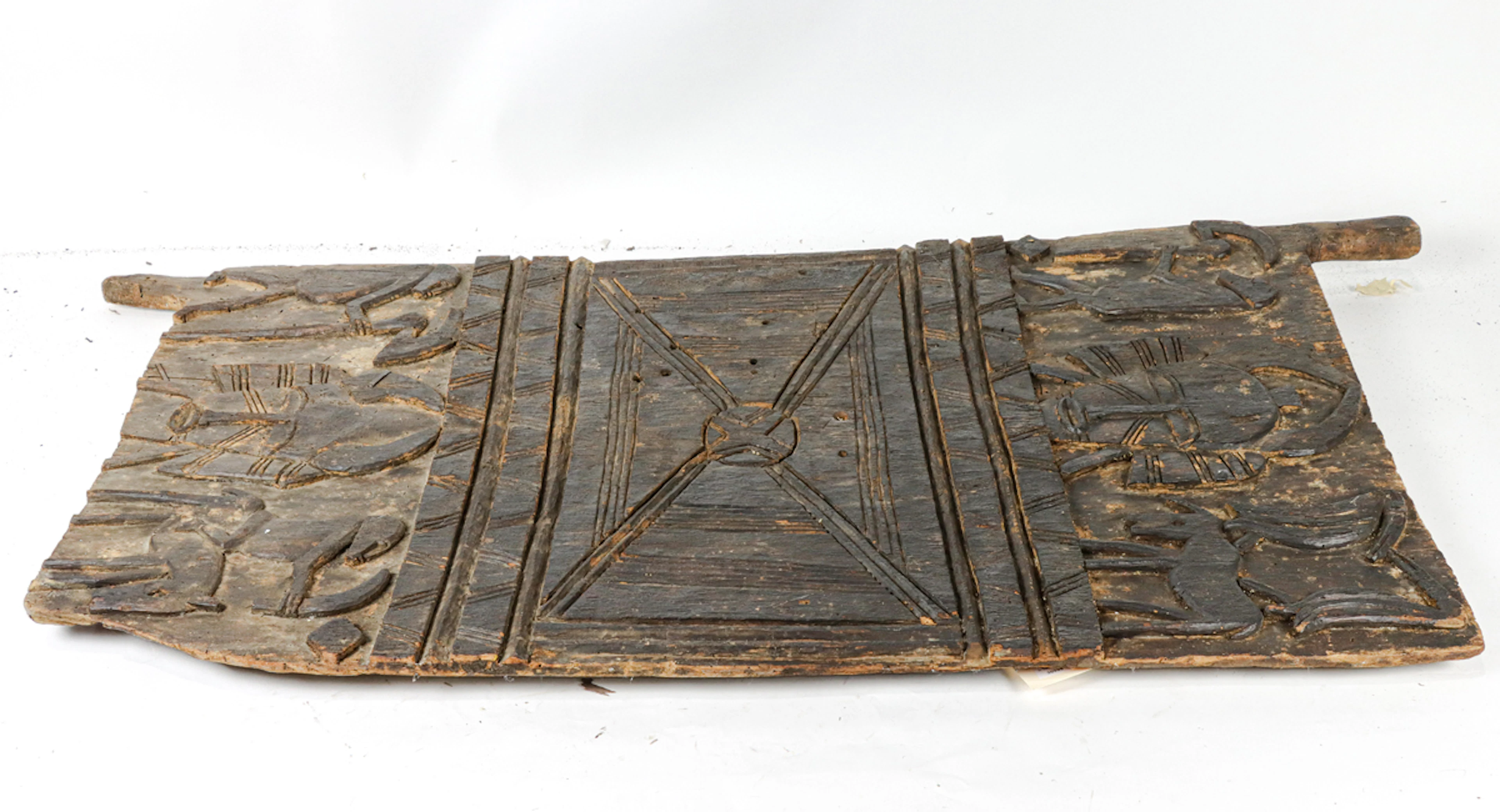 A large African carved granary door