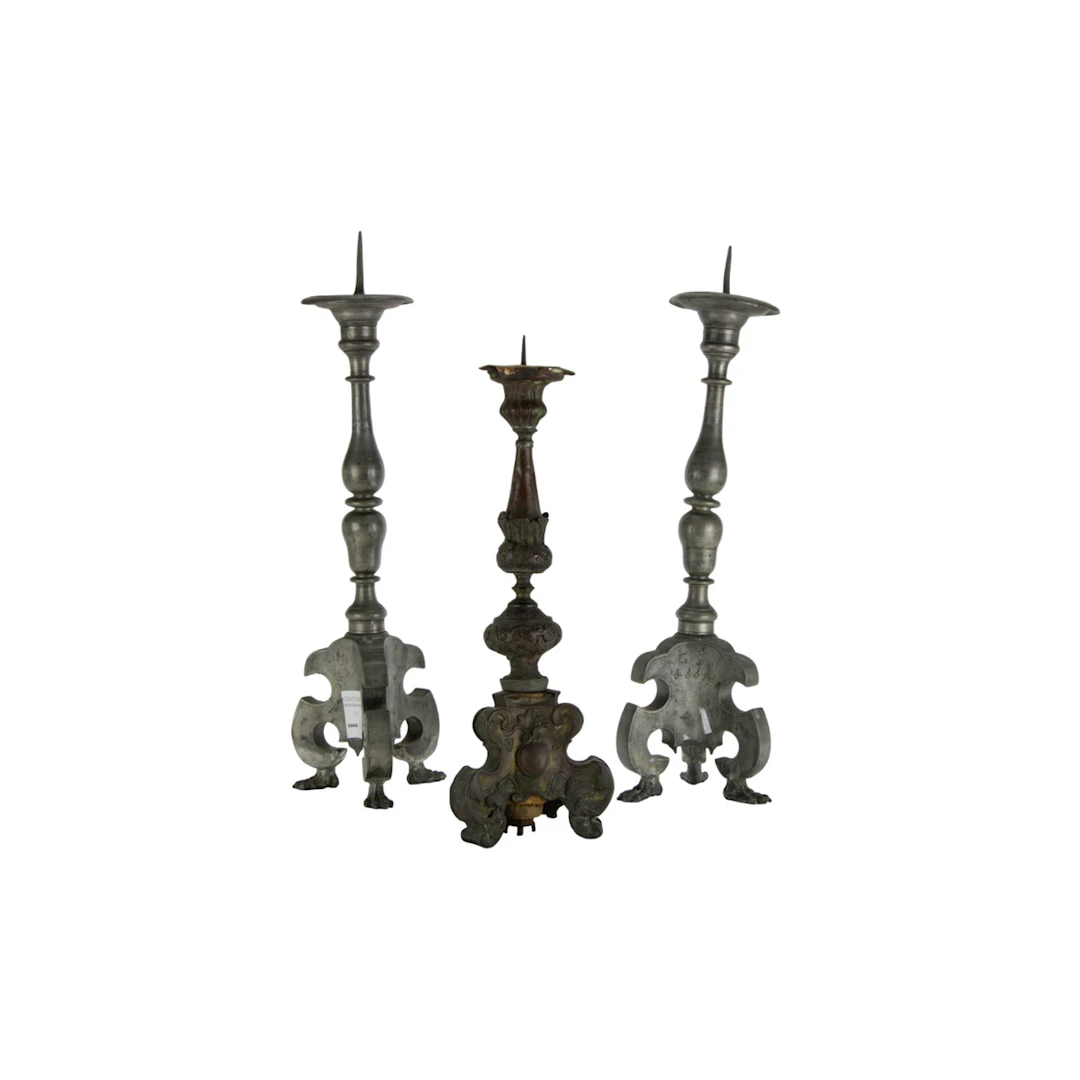 A pair of Continental Baroque pewter candle prickets