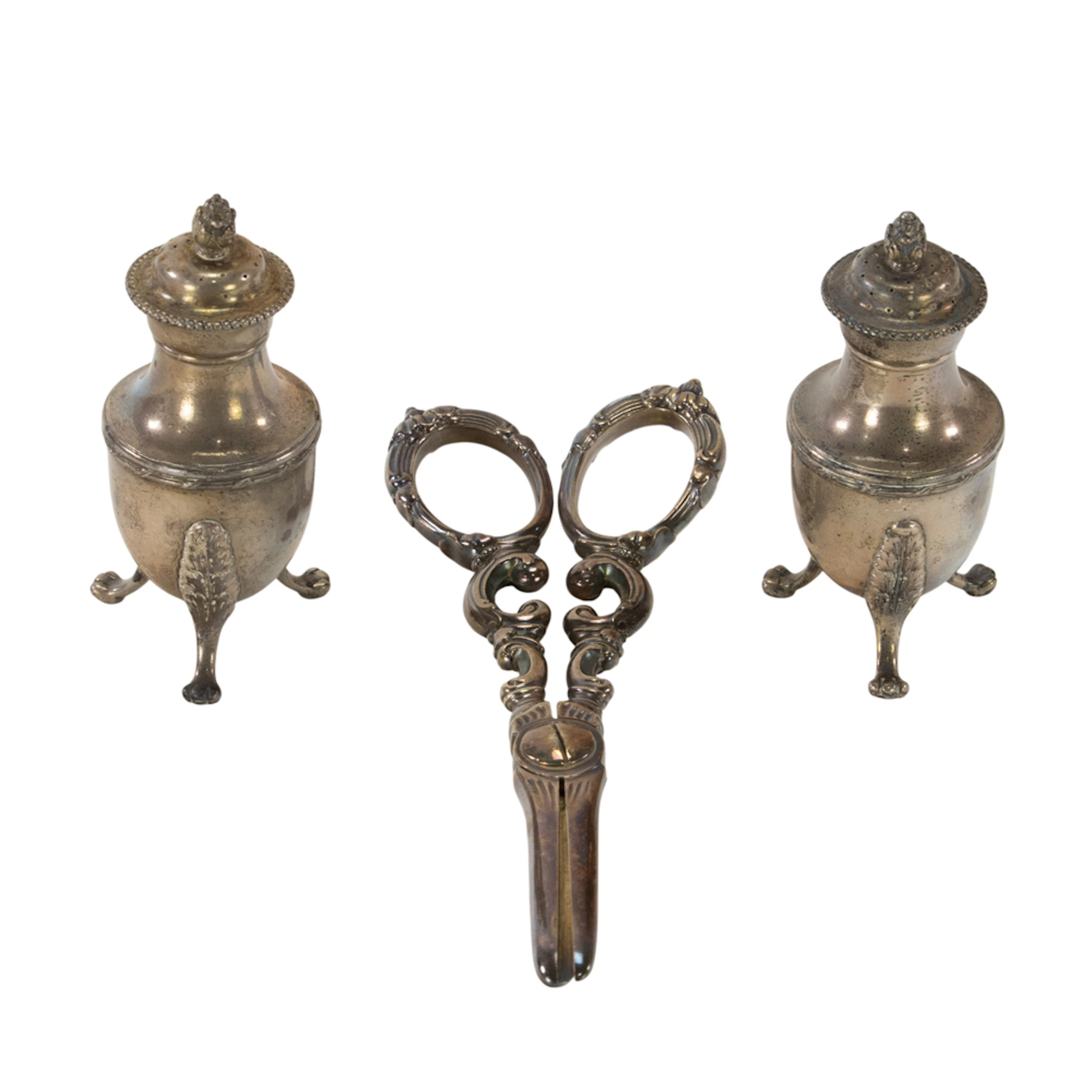 A sterling pair of tripod pepper casters, Tiffany & Co