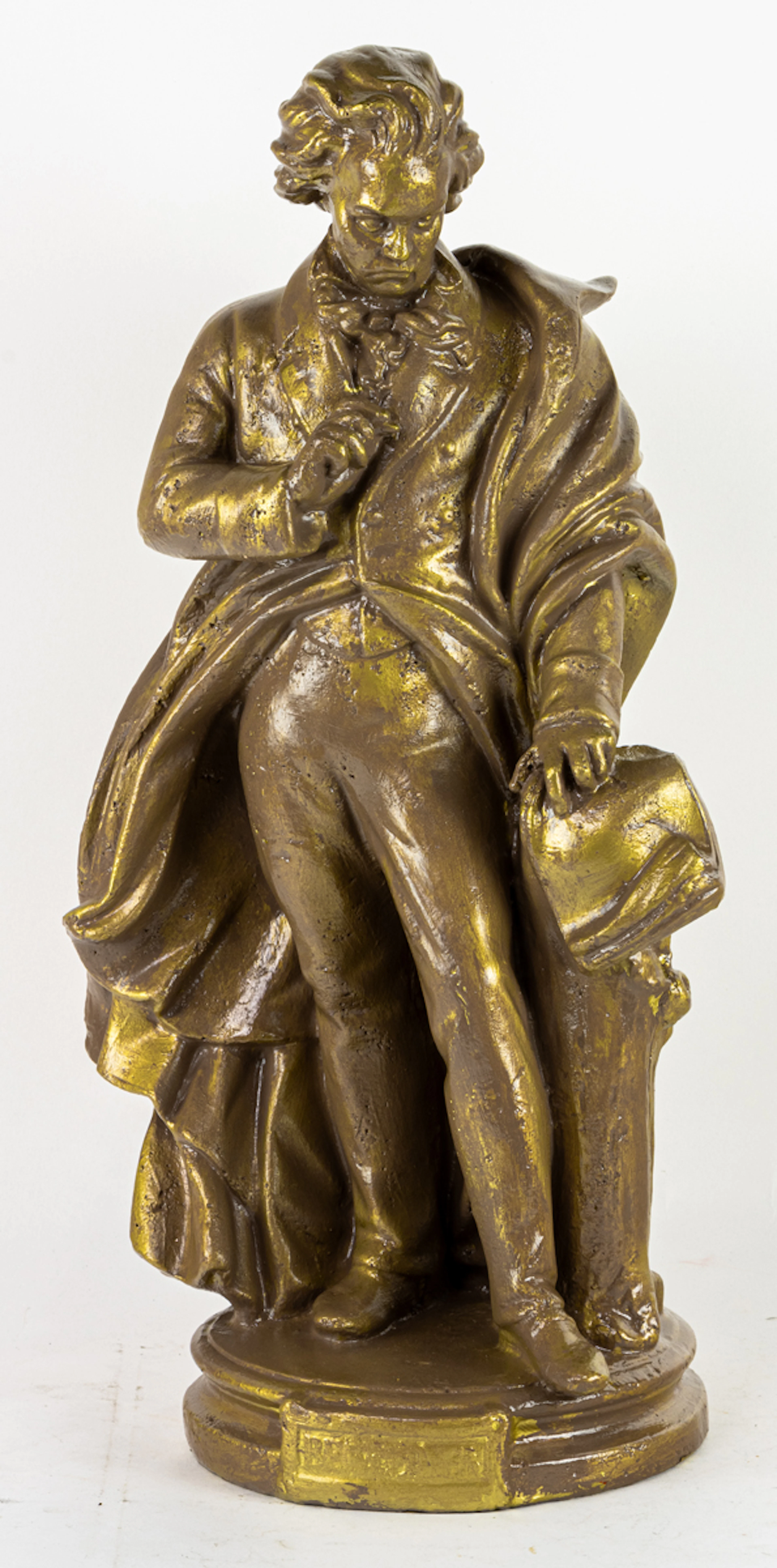 A painted plaster figure of Ludwig van Beethoven in repose