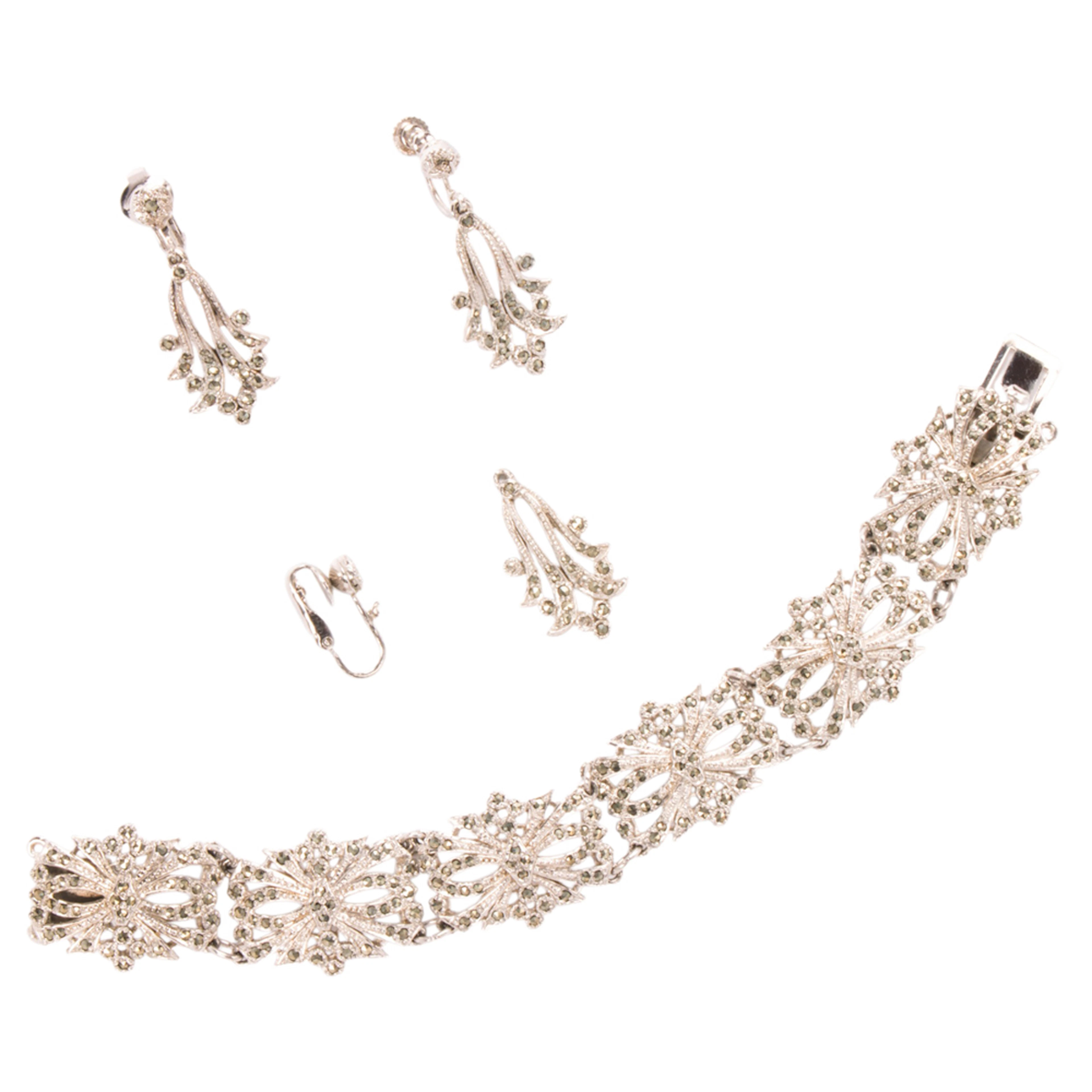 A silver bracelet and ear-clip set