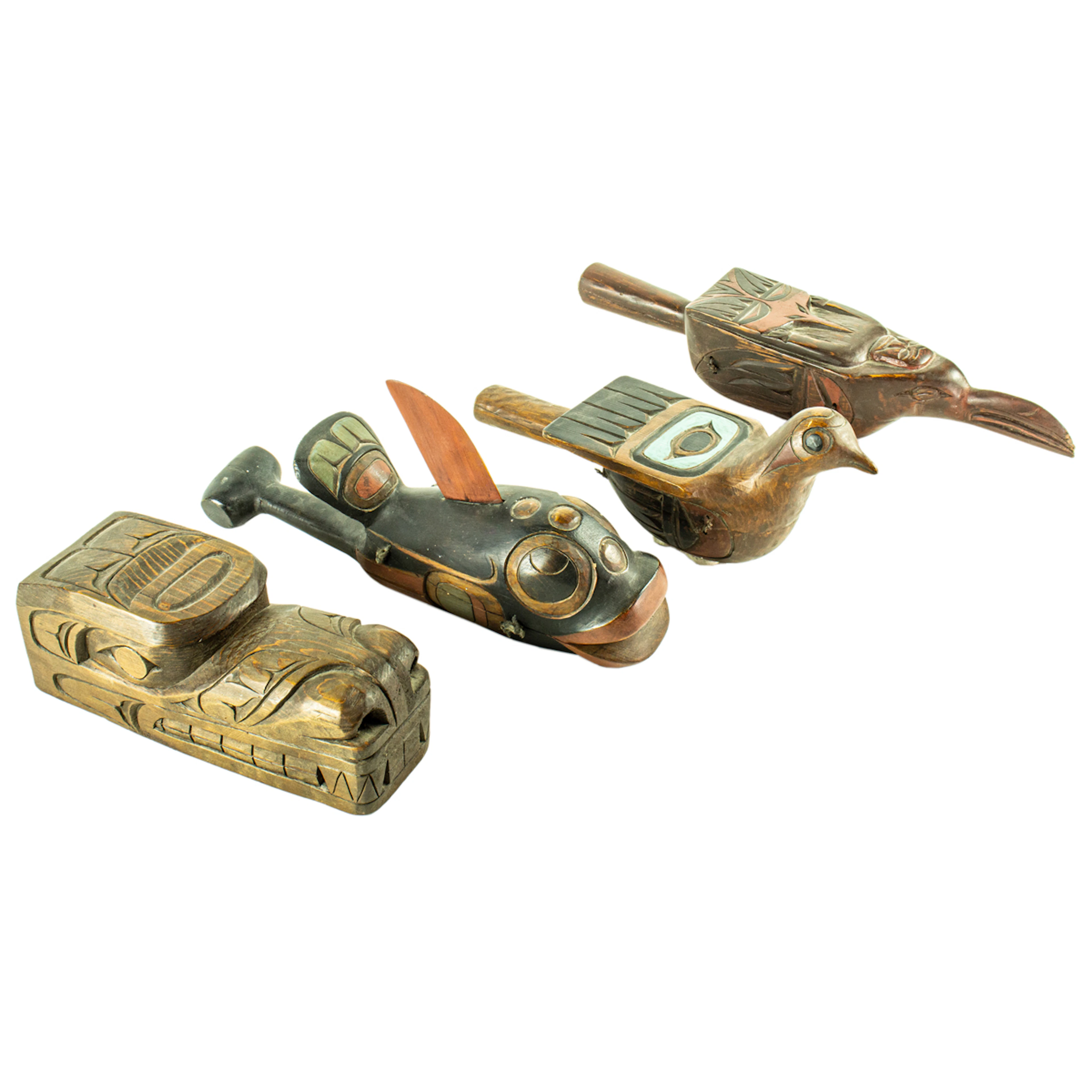 Three Kwakiutl rattles and a raven mask by John Livingston (1951-2019)