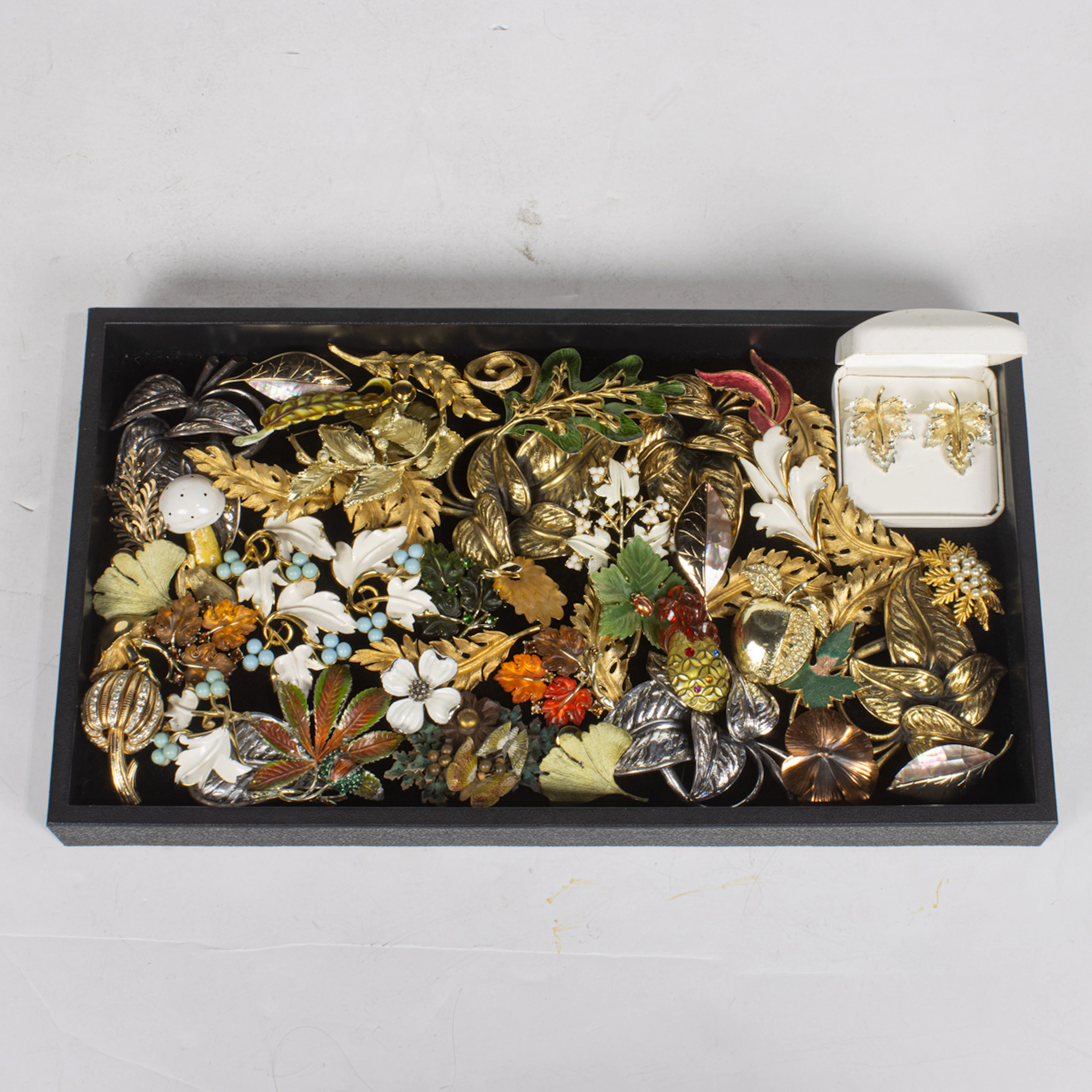 Fifty costume jewelry brooches of foliage and fruits, comprising Sarah