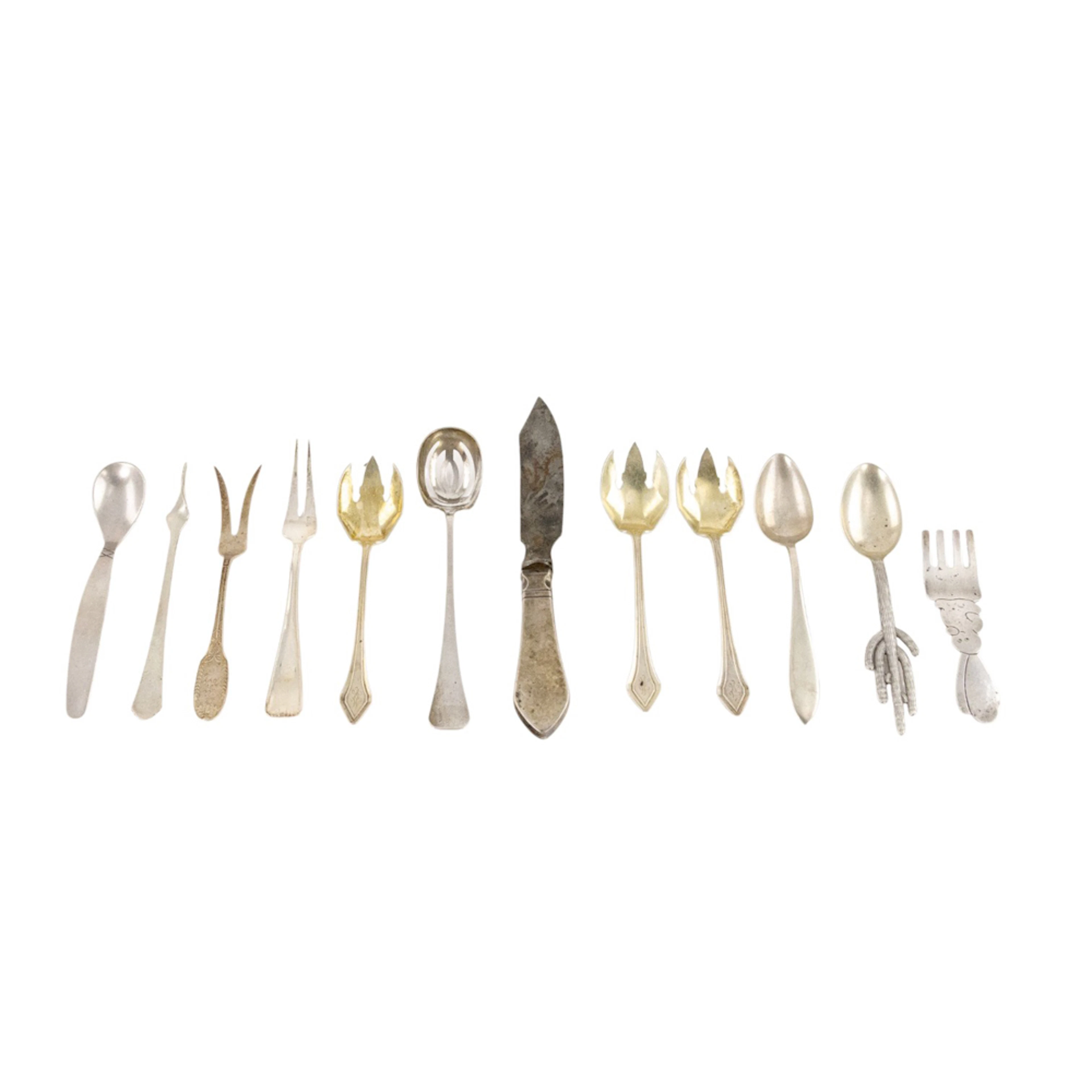A group of sterling flatware