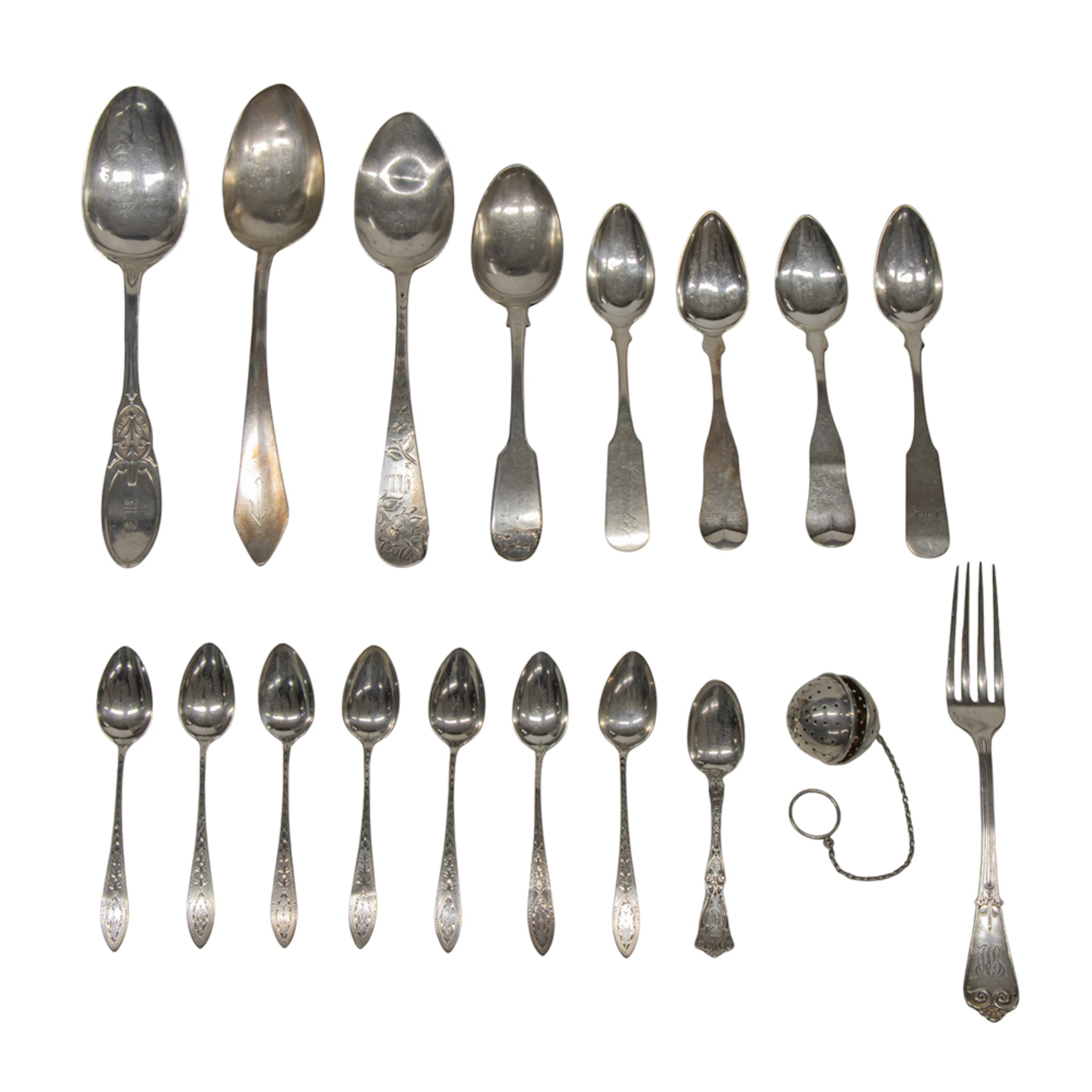 A group of silver flatware