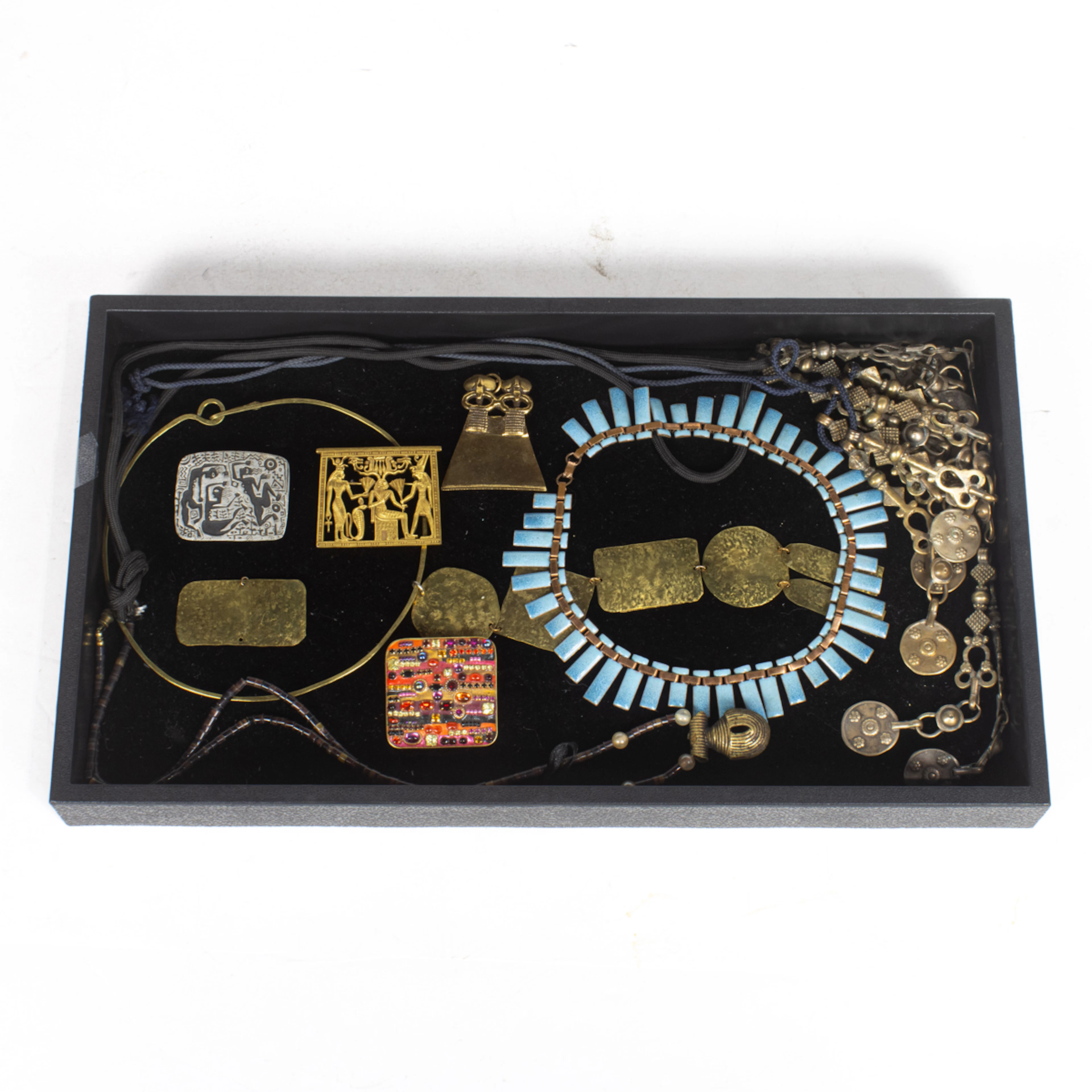 Eight pieces of museum reproduction and vintage costume jewelry comprising