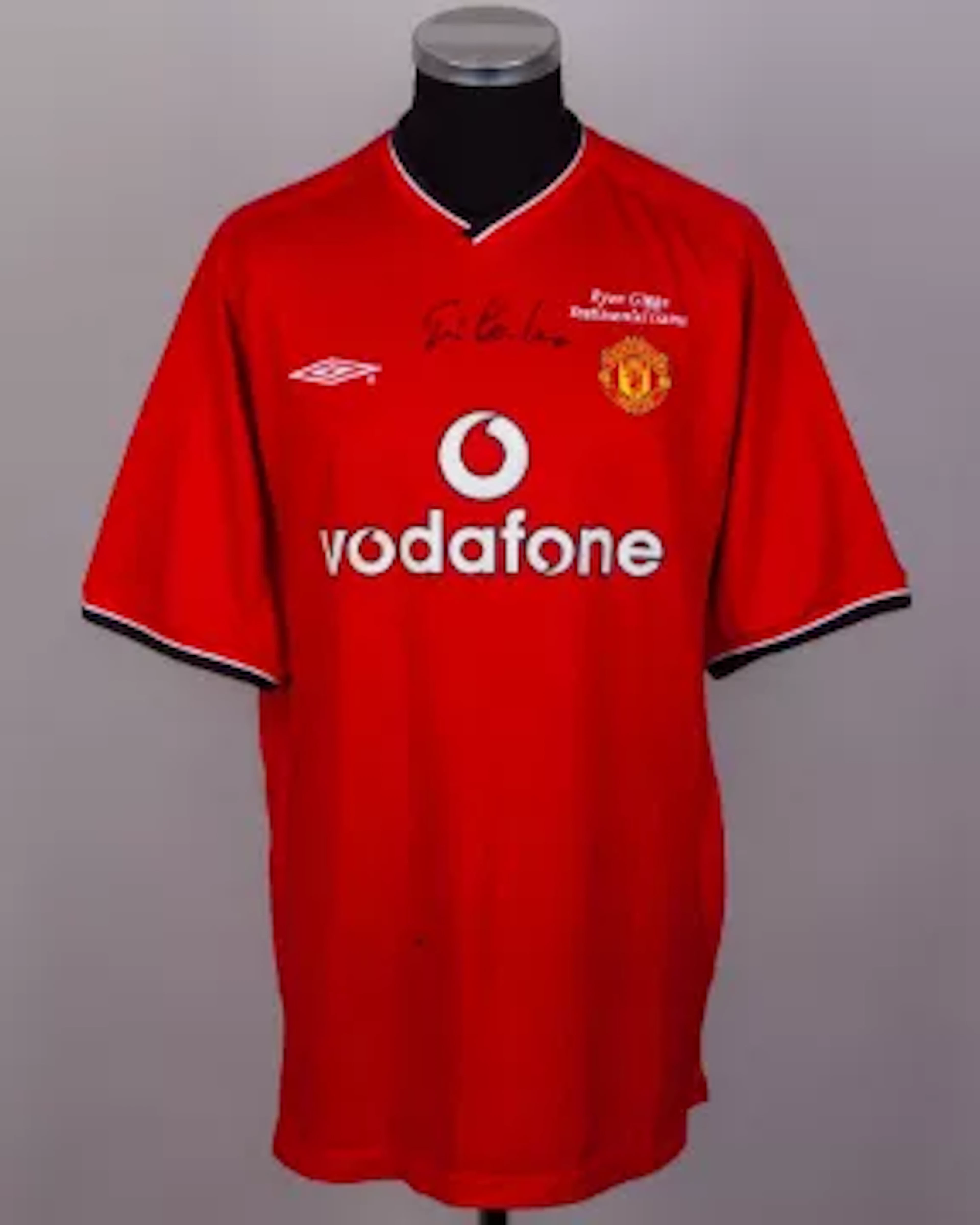 A red No.7 Ryan Giggs Testimonial short-sleeved shirt autographed