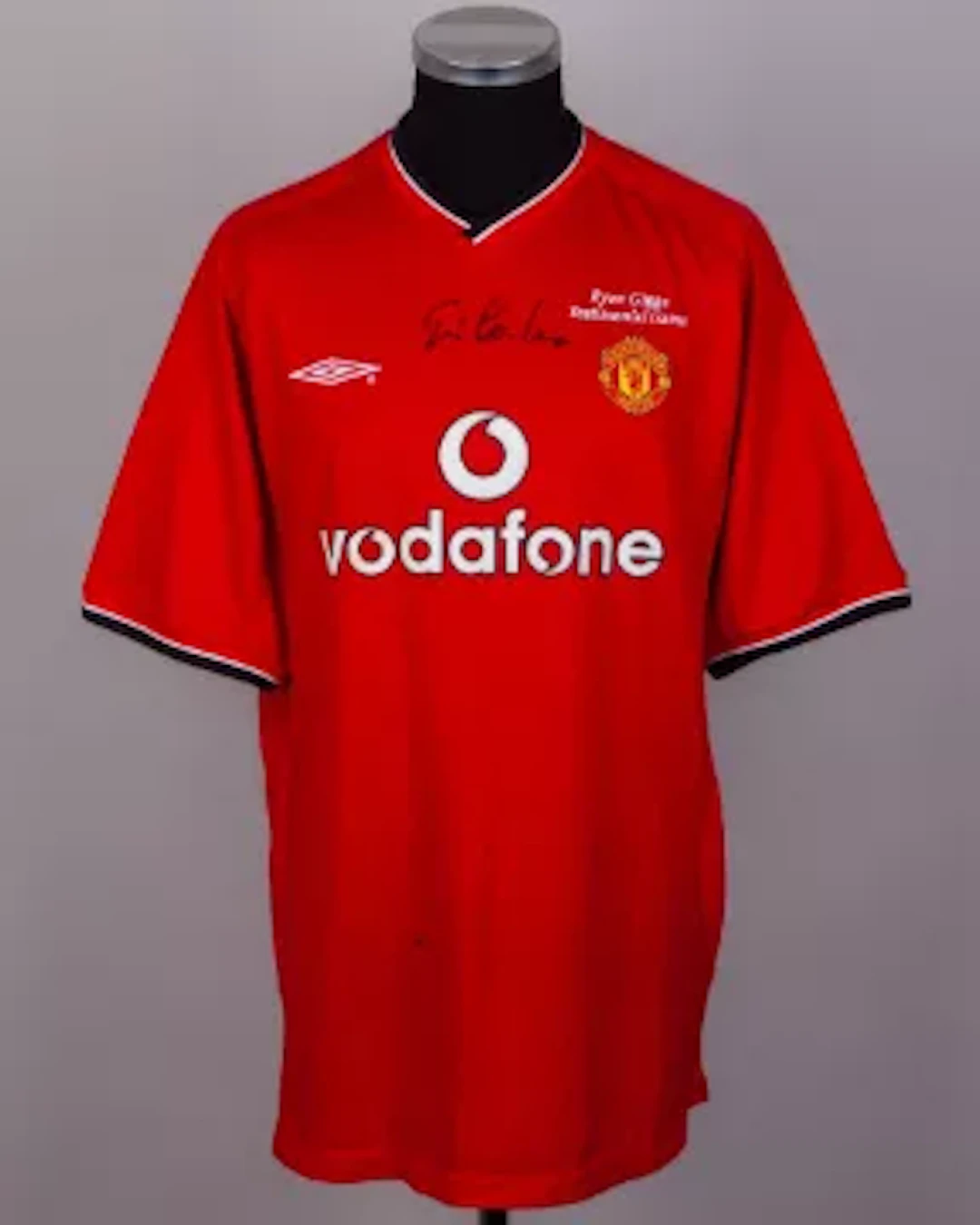 A red No.7 Ryan Giggs Testimonial short-sleeved shirt autographed