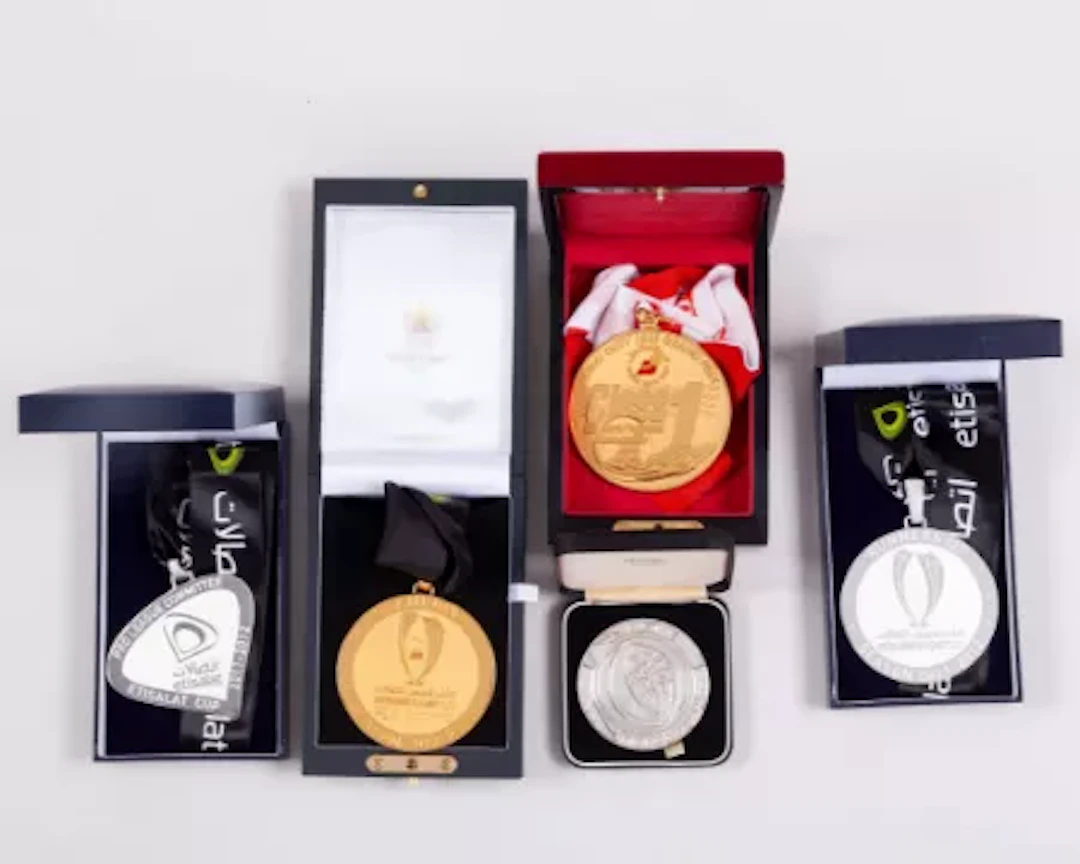 A yellow-metal Etisalat Super Cup Champions medal, 2012-13