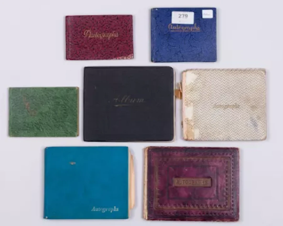 Seven cricket autograph books