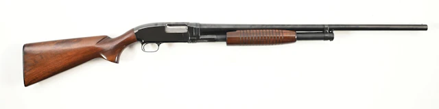(C) WINCHESTER MODEL 12 SLIDE ACTION SHOTGUN.