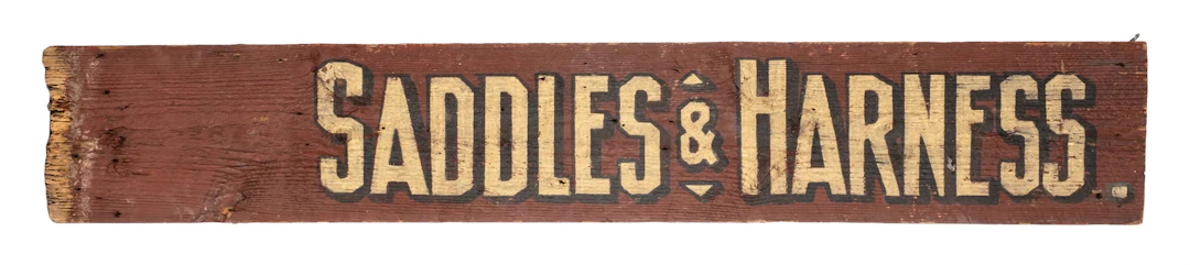 VERY PRIMITIVE WOODEN SIGN FOR SADDLES AND HARNESS