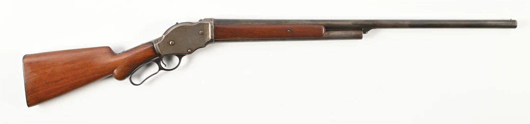 (A) WINCHESTER 1887 12 GAUGE LEVER ACTION SHOTGUN.