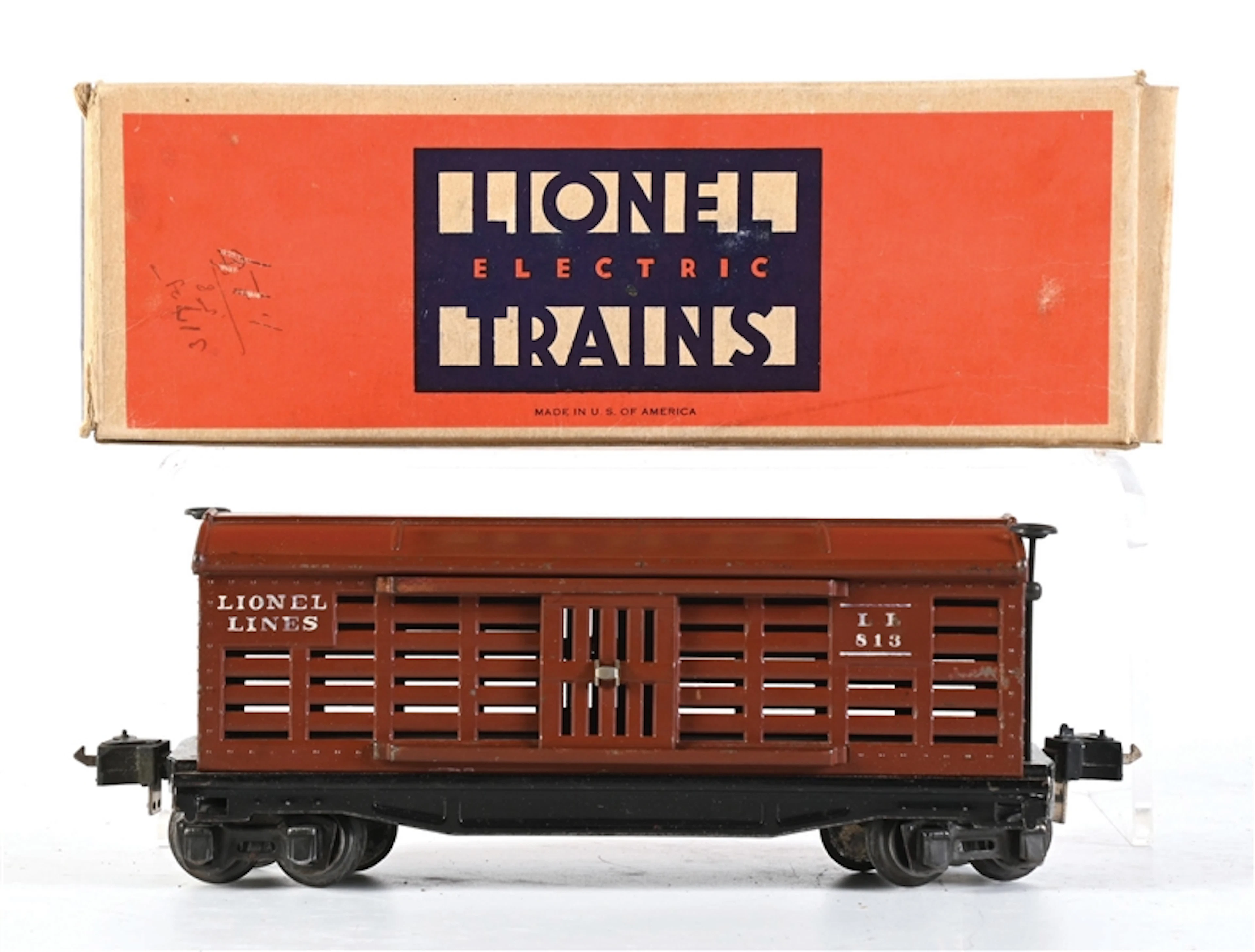 PRE-WAR LIONEL O-GA. NO. 813 TUSCAN RUBBER-STAMPED CATTLE CAR WITH ORIGINAL BOX