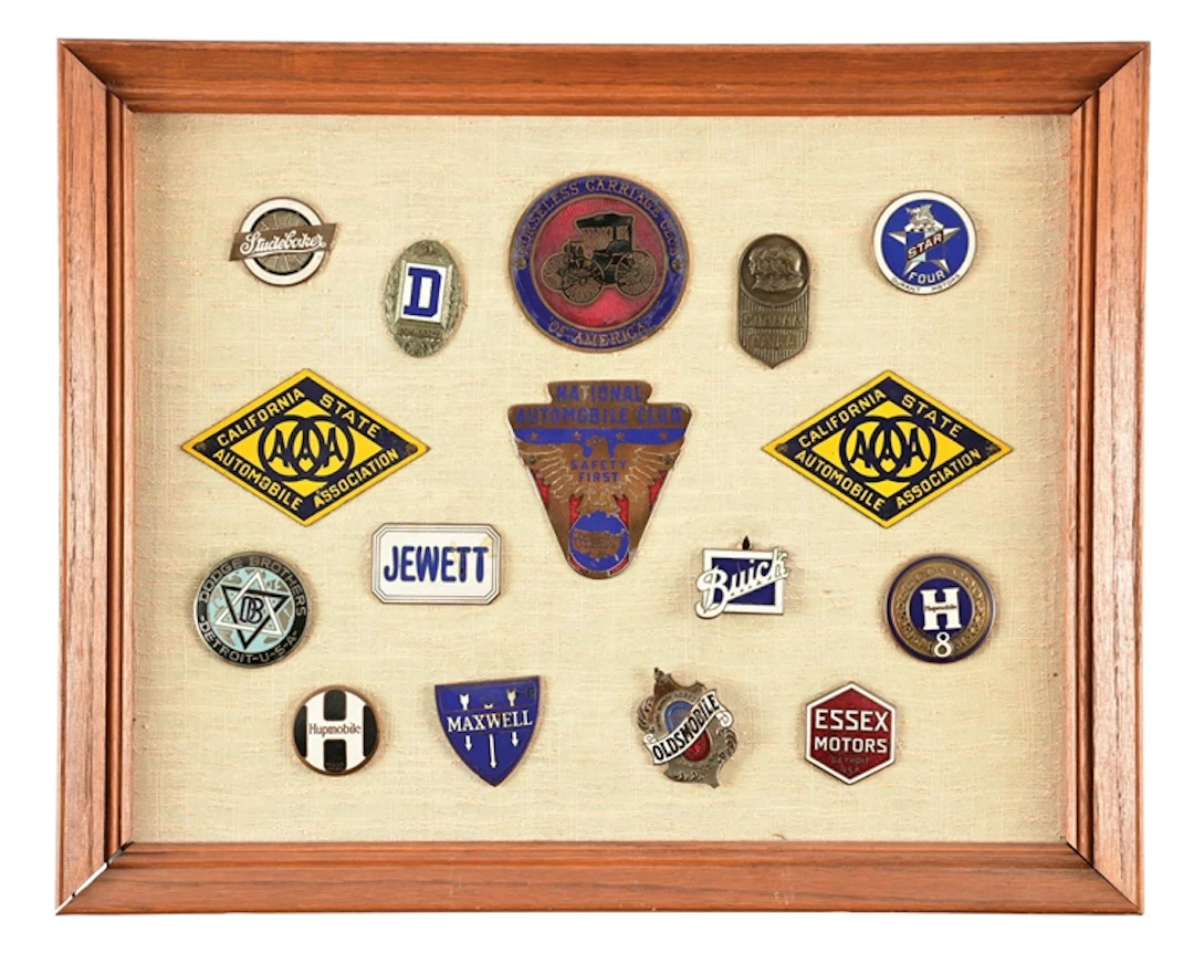 FRAMED AUTOMOBILE & RADIATOR BADGE COLLECTION.