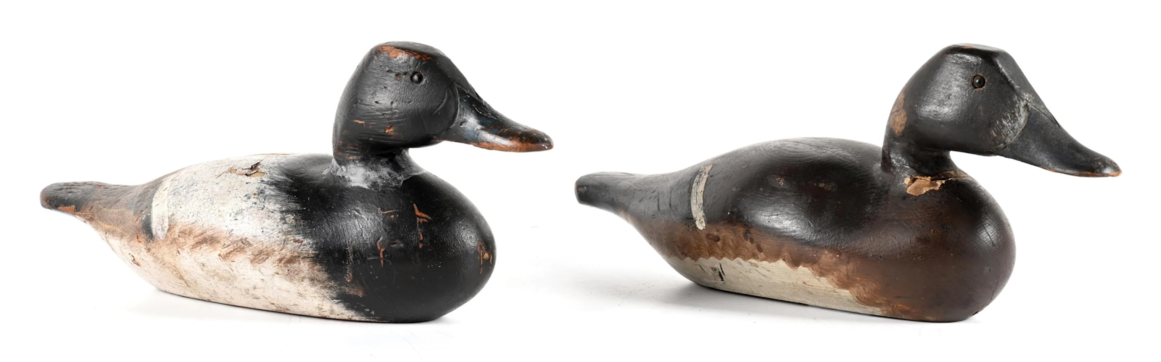 A PAIR OF VINTAGE WOODEN DUCK DECOYS