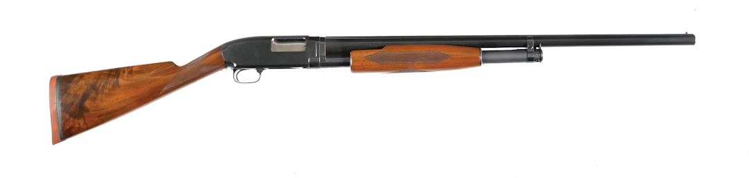 (C) WINCHESTER DELUXE MODEL 12 SLIDE ACTION SHOTGUN.