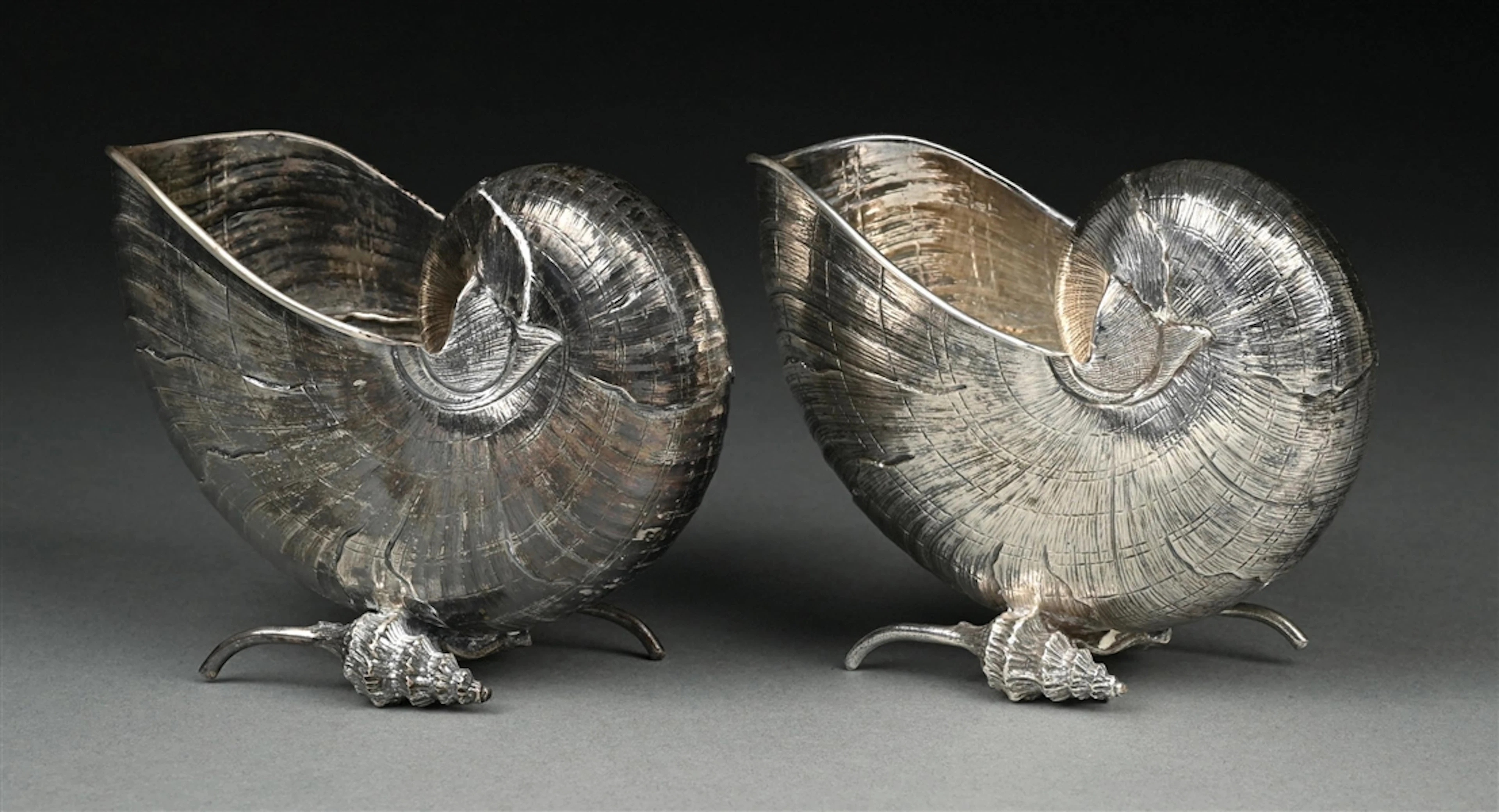A PAIR OF BUCCELLATI STERLING SHELL FORM SPOON WARMERS