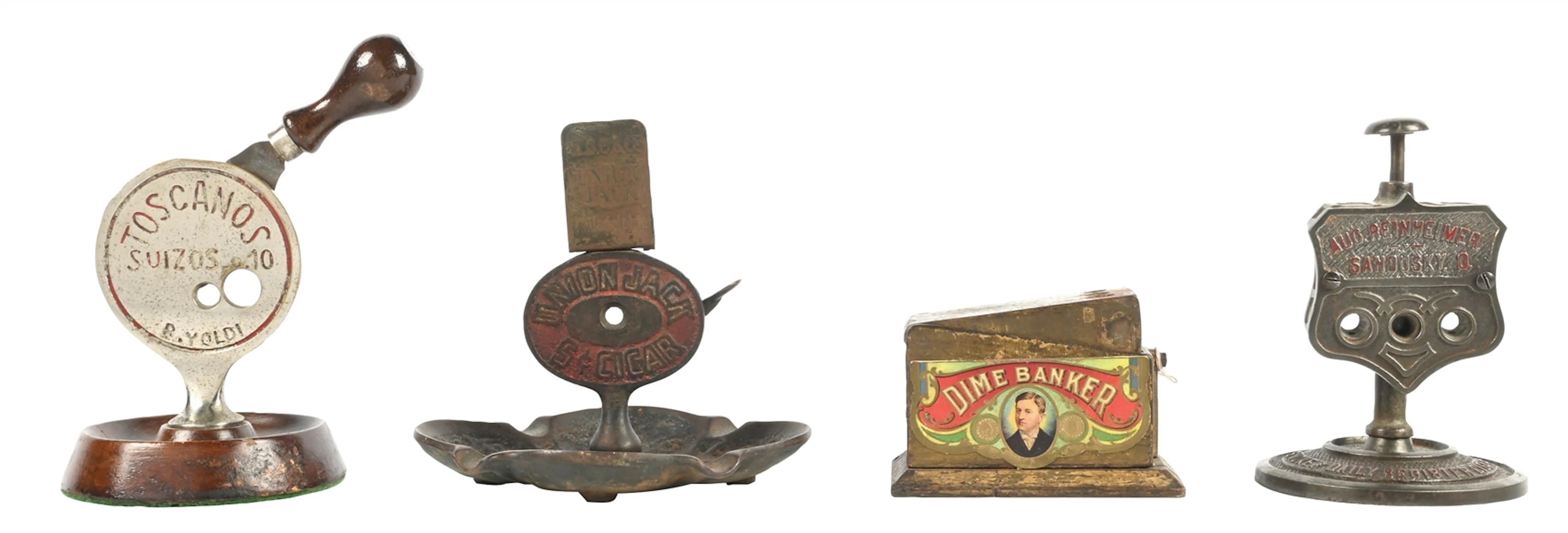 COLLECTION OF 4: ASSORTED ADVERTISING CAST IRON CIGAR CUTTERS