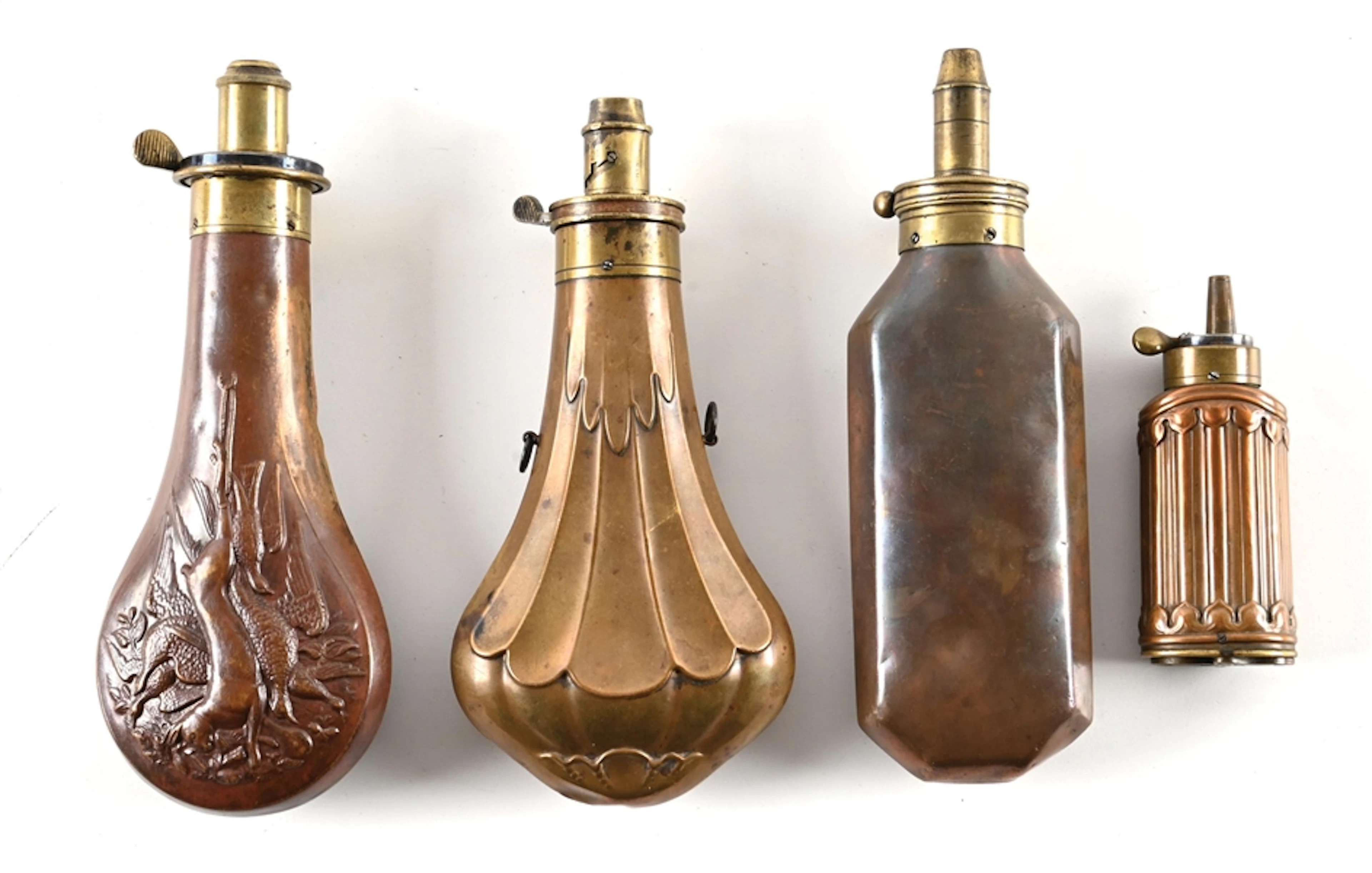 LOT OF 4: CAPTIVATING BRASS POWDER FLASKS.