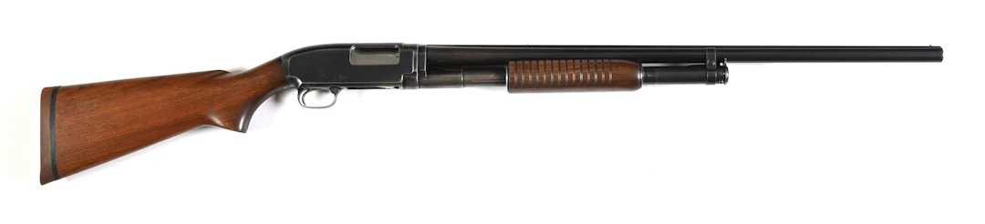 (C) WINCHESTER MODEL 12 SLIDE ACTION SHOTGUN.