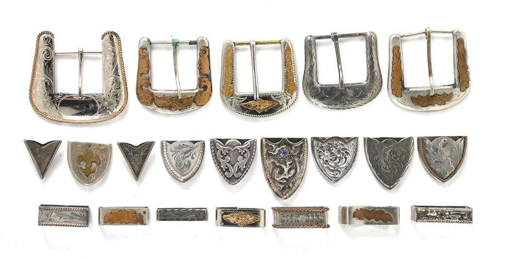 LOT OF WESTERN STYLE BUCKLES, KEEPERS, AND COLLAR TIPS