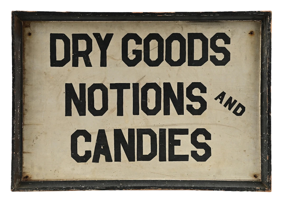 DRY GOODS NOTIONS AND CANDIES HAND PAINTED WOOD SIGN W/ ORIGINAL FRAME.