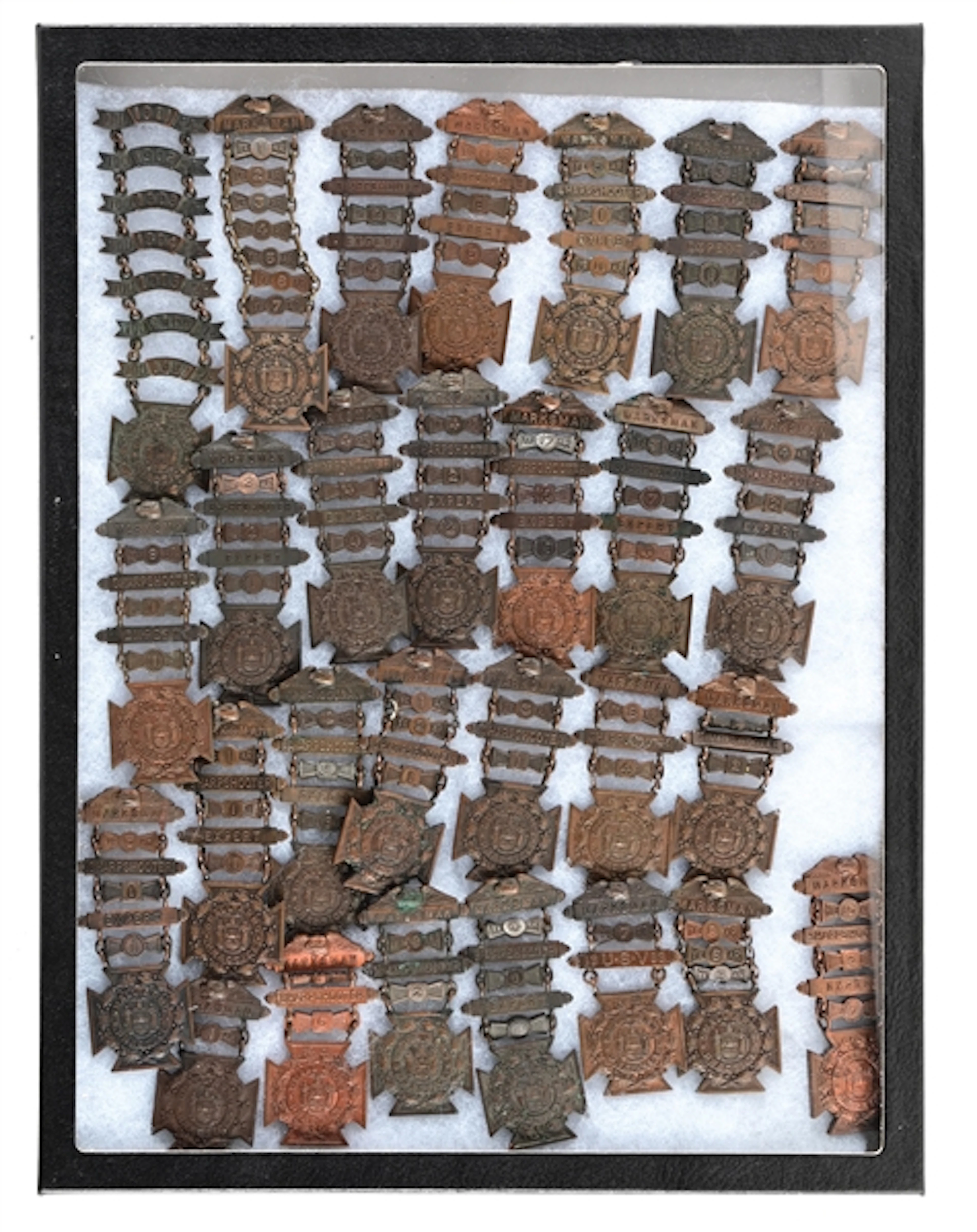 LOT OF 28 TIFFANY & CO. NEW TORK MARKSMAN MEDALS.