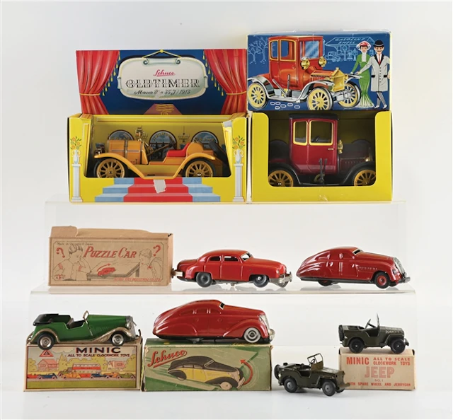 LOT OF 8: SCHUCO OLDTIMER FORD COUPES AND JAPANESE MADE PUZZLE CARS W/ BOXES